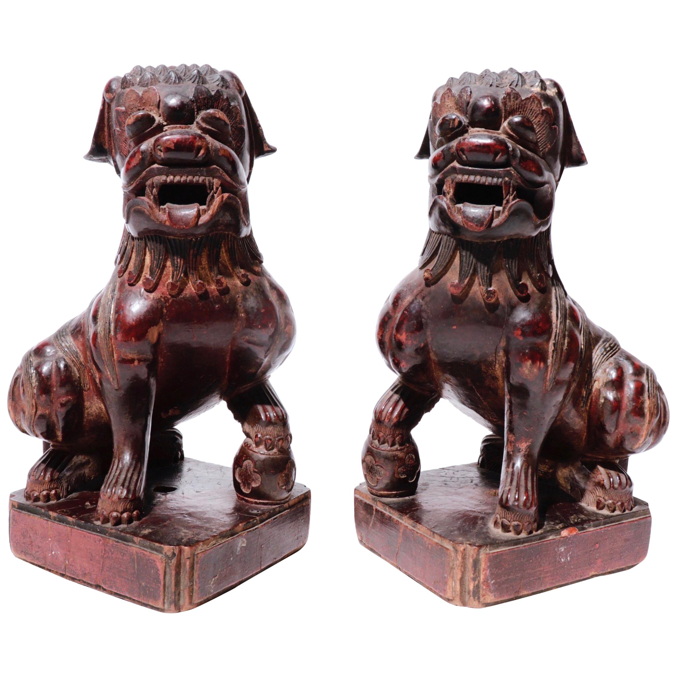 Antique Chinese Pair of Red Lacquered Wooden Fu Dogs, Qing Dynasty For Sale