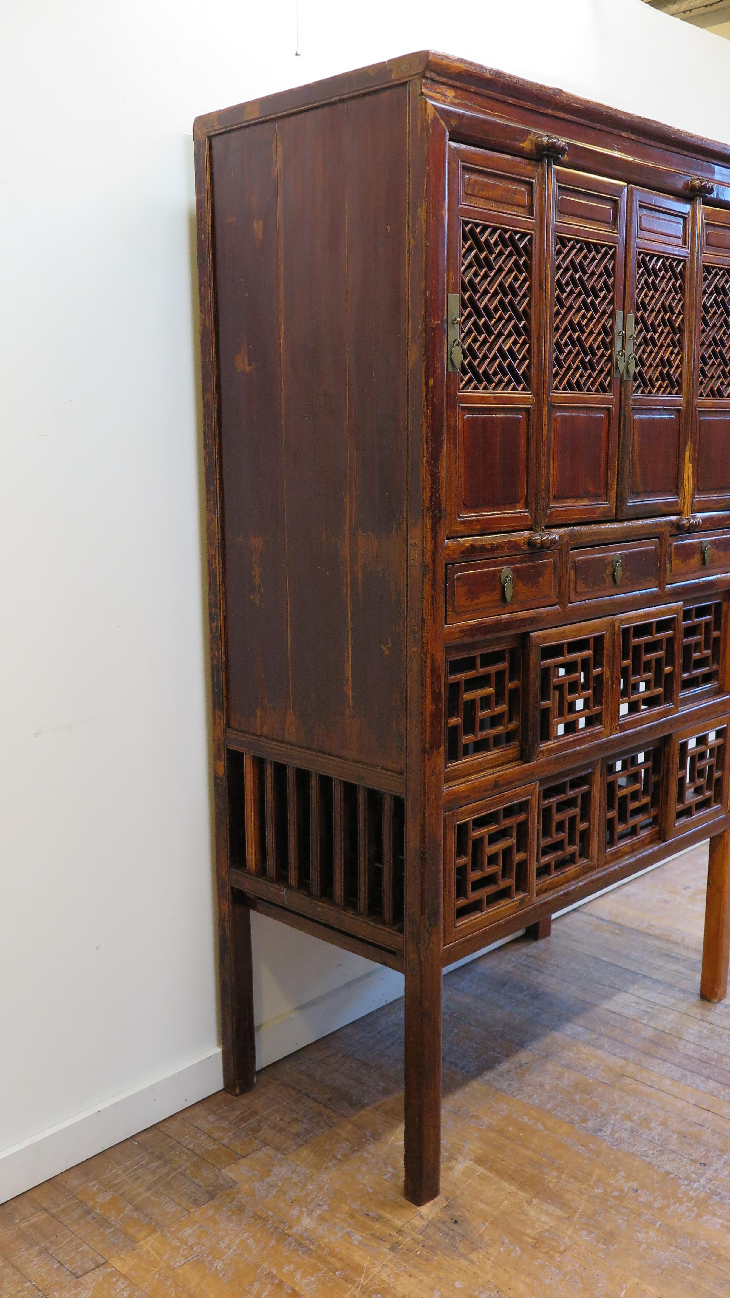 19th century pantry cabinet Chinese kitchen cabinet. Antique kitchen cabinet cupboard. Cyprus wood with intricate fretwork screen doors, and sides. These types of cabinets where mostly used to store food allowing for air circulation. Traditional