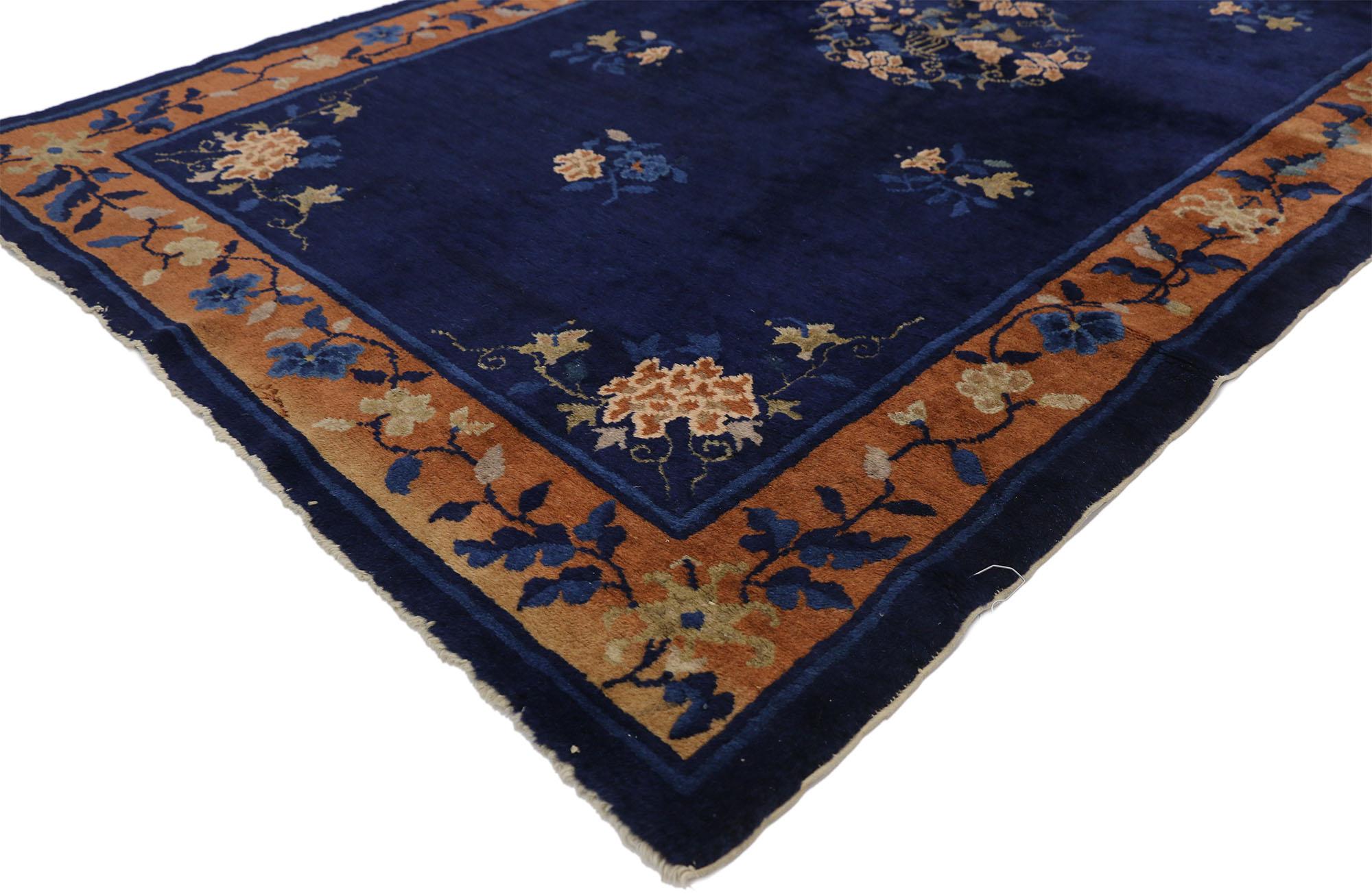 74478, antique Chinese Peking Accent rug with Chinese Art Deco style. This antique Peking rug showcases a beautiful Chinese Art Deco style. It has a circular shaped central medallion made up of floral vines and sparse sprays of flowers frame the