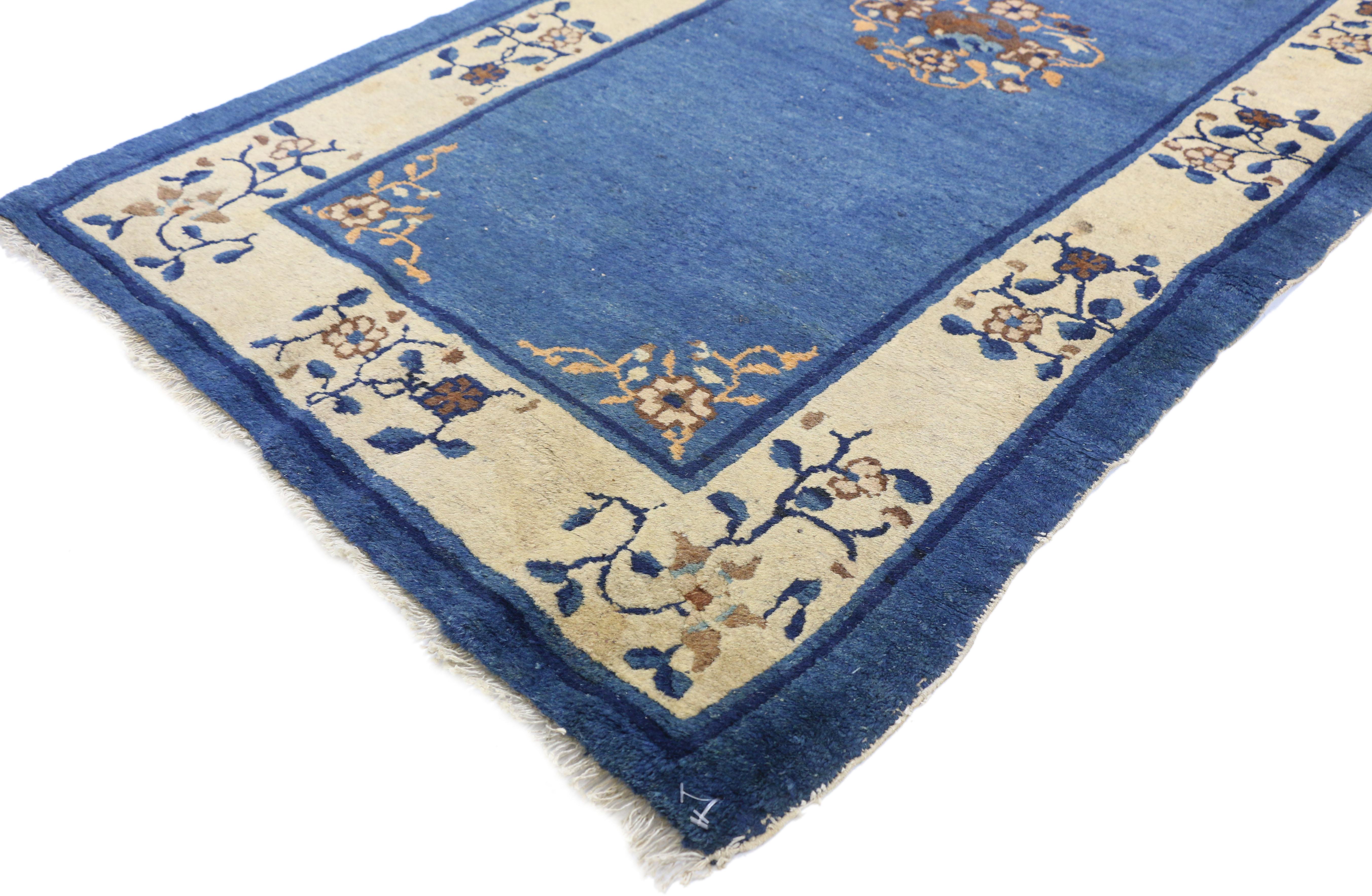 73471 Antique Chinese Peking Accent Rug with Neoclassical Chinoiserie Style 03'00 x 05'09. This hand knotted wool antique Chinese Peking rug features an open center medallion with a swirl of peonies and crabapple blossoms floating in the center of