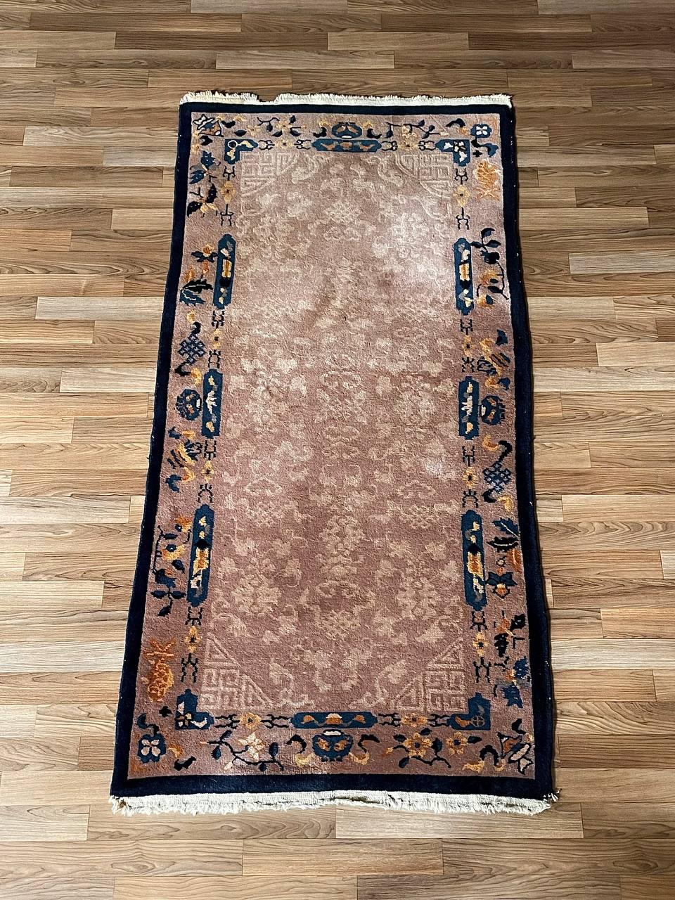 Condition: Original Vintage Condition

Materials: Hand-Knotted Wool
Style: Chinese Peking
Dimensions: 0.25”H x 73”W x 36”D

This vintage Chinese Art Deco rug from the 1930s is a beautiful example of early 20th-century craftsmanship during the