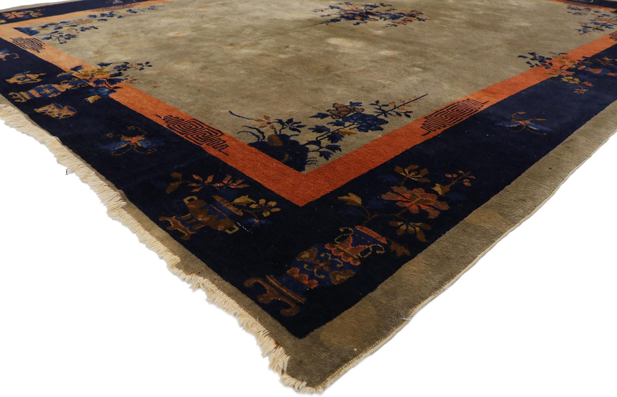 78126 Antique Chinese Peking Rug, 09'00 x 11'01. This meticulously hand-knotted wool antique Chinese Peking showcases a captivating interplay of symbolism and artistry. Set against a sophisticated taupe backdrop, the rug's focal point is a cloisonné