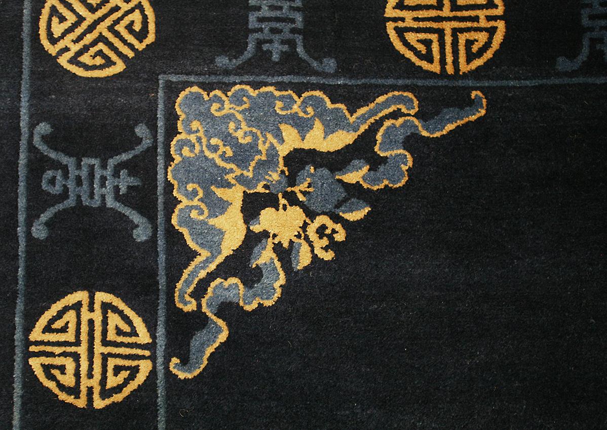 This exquisite Peking rug is a must-have for any discerning collector or interior designer. Hand-knotted in China over a hundred years ago, it features a stunning design with symbolic motifs. The colors are beautiful and specific to the peking area