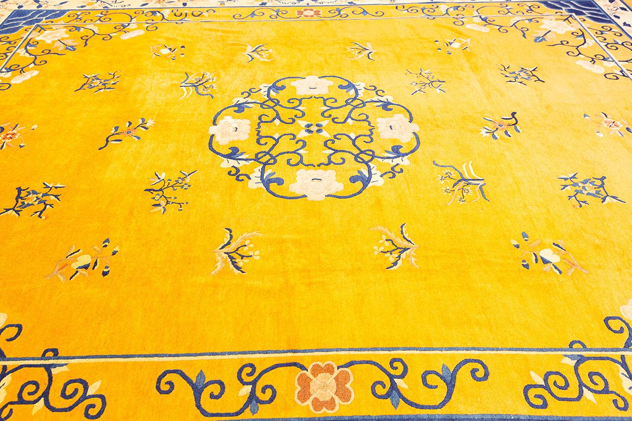 This unique and exquisite Chinese peking rug is hand-knotted with a cotton and wool kork pile. The minimalistic design is in a beautiful gold color, which will add a luxurious touch to any room. The rug is also very durable and easy to care for,