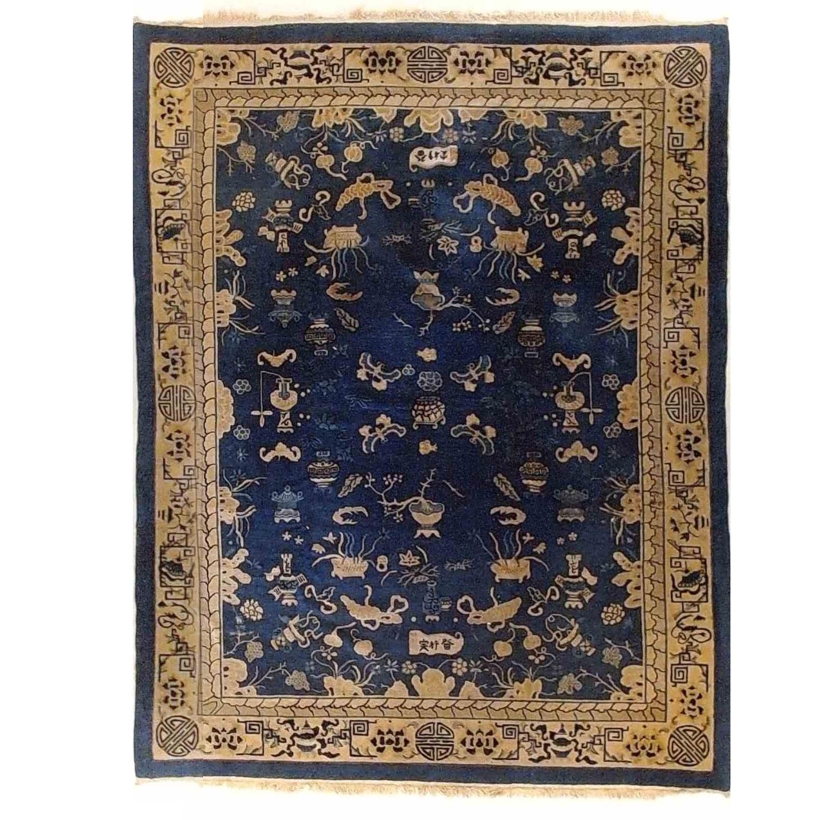 An antique Chinese Peking oriental rug offers wool construction with detached garden elements throughout, circa 1910

Measures - 127