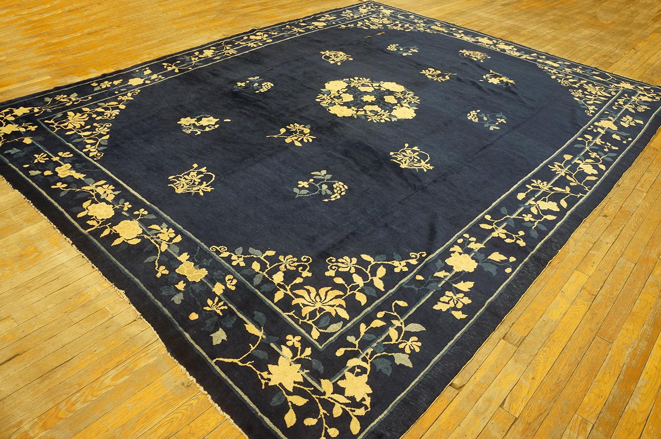 Antique Chinese - Peking rug. Measures: 9' 0'' x 11' 4''.
Navy background.