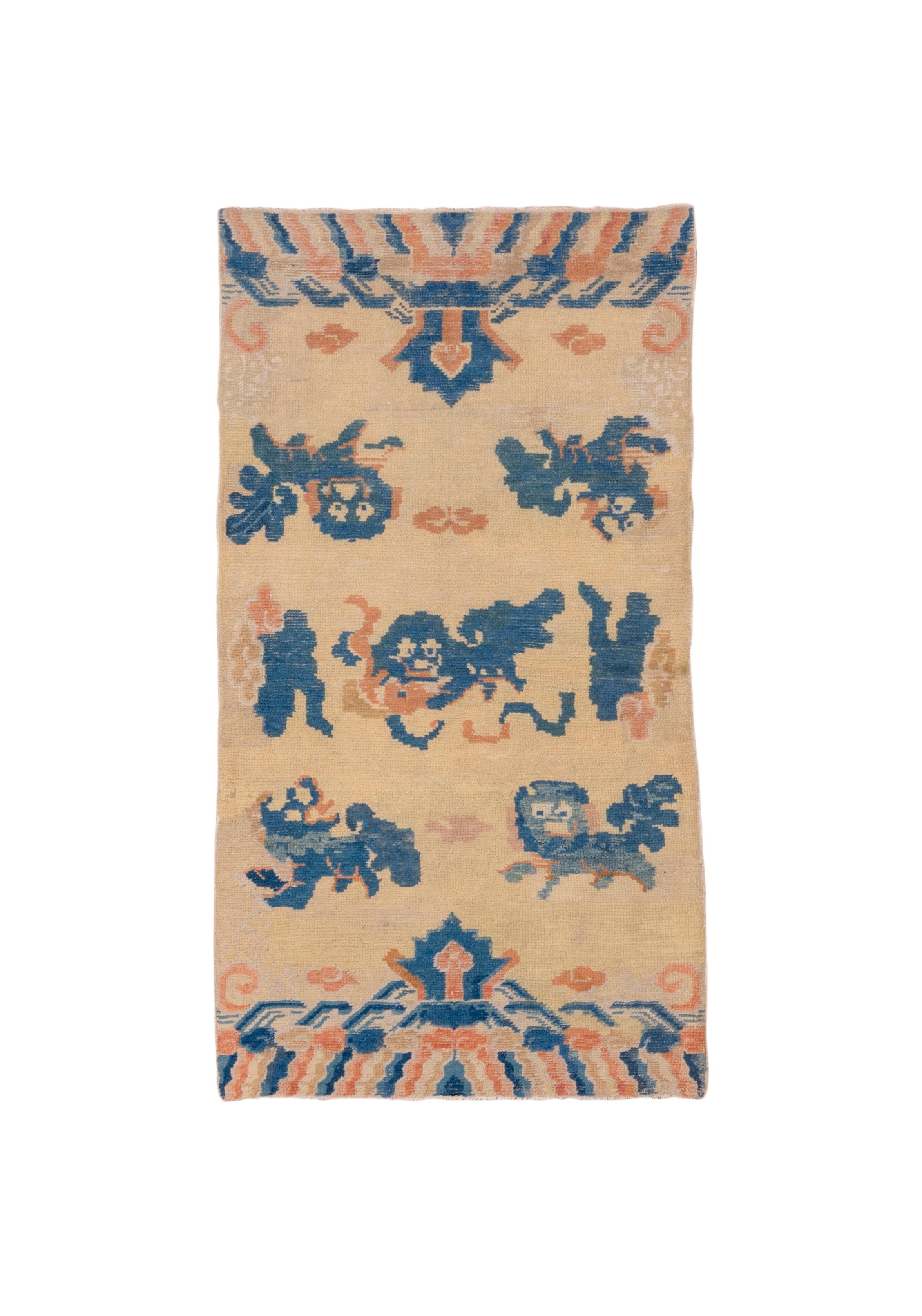Five lion dogs cavort among clouds, with mountains and waves at the ends closing the composition.  Dark blue is the major accent tone. Five lion dogs have no specific reference, as opposed to nine, for example. Good condition, on cotton. Moderate