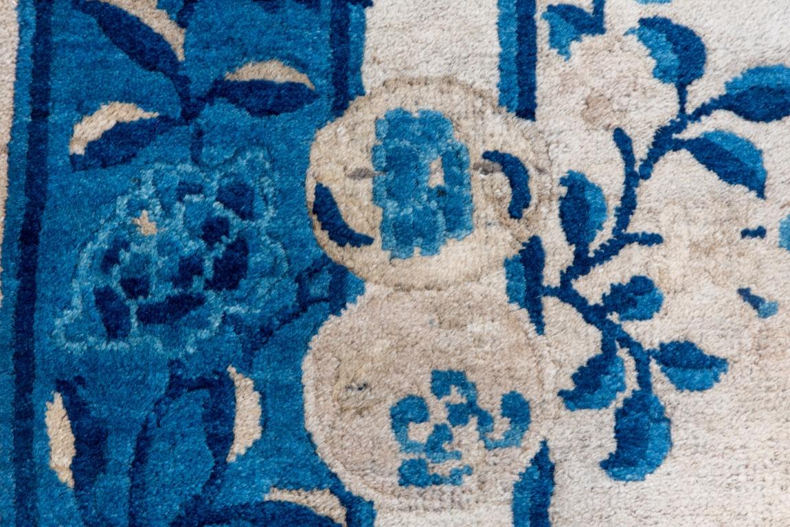 20th Century Antique Chinese Peking Rug with a Sand Field and Blue Border For Sale
