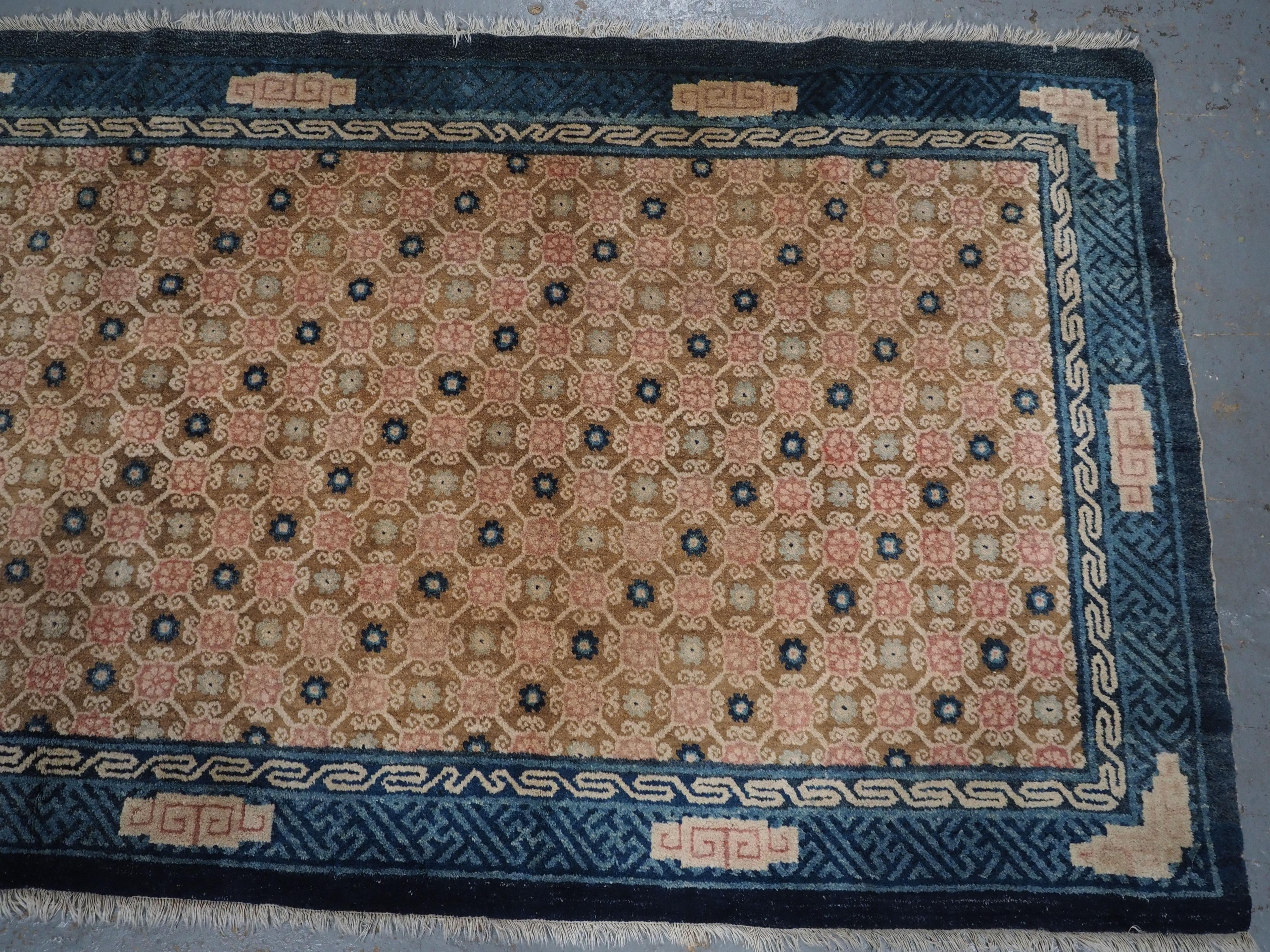 Early 20th Century Antique Chinese Peking rug with lattice design.  Circa 1900. For Sale