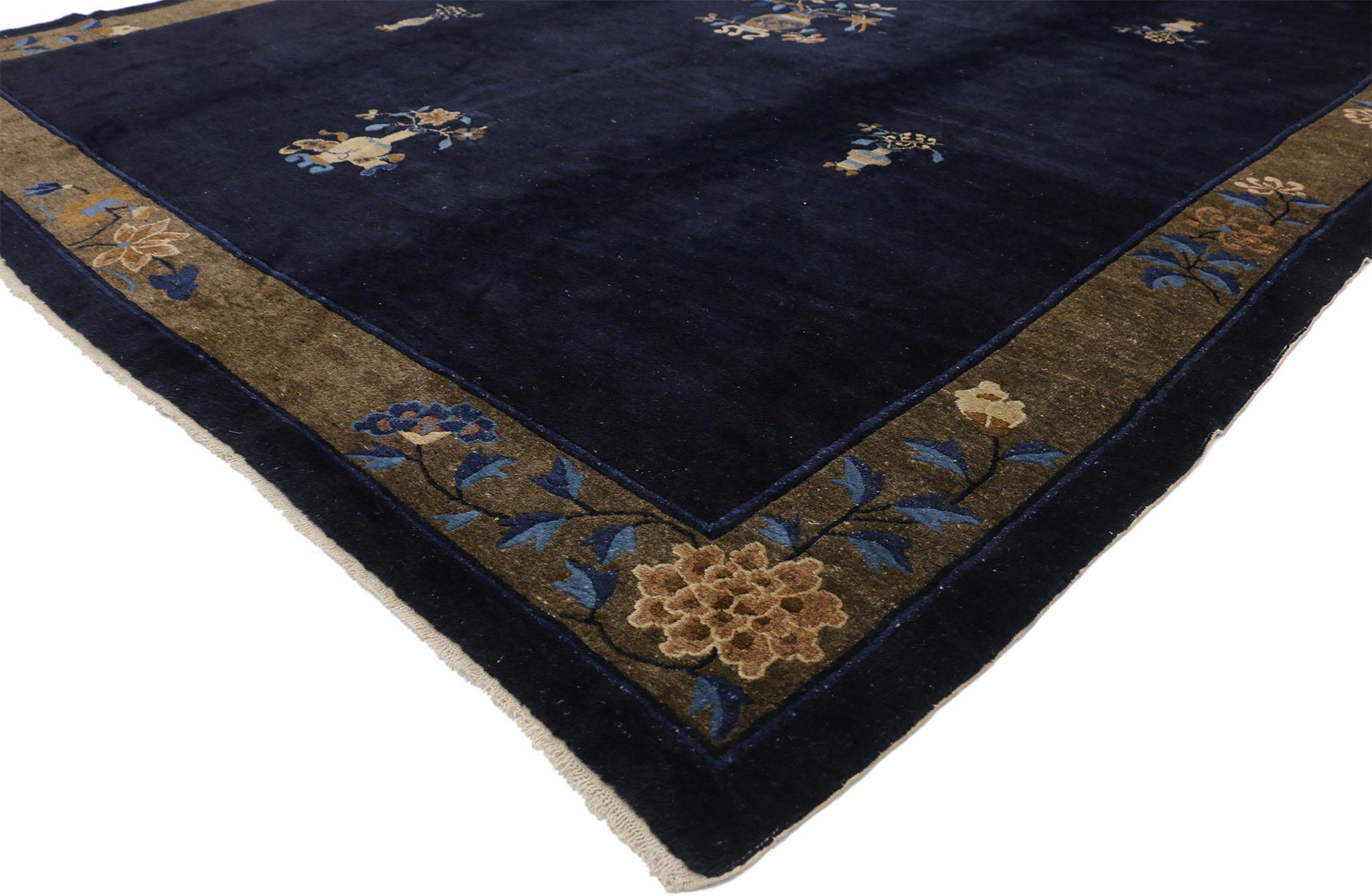 77238 Antique Chinese Peking Rug with Traditional Chinoiserie Style 09'00 x 11'07. This hand-knotted wool antique Chinese Peking rug features a constellation of seven flowering vases floating on an abrashed ink blue field. The center vase contains