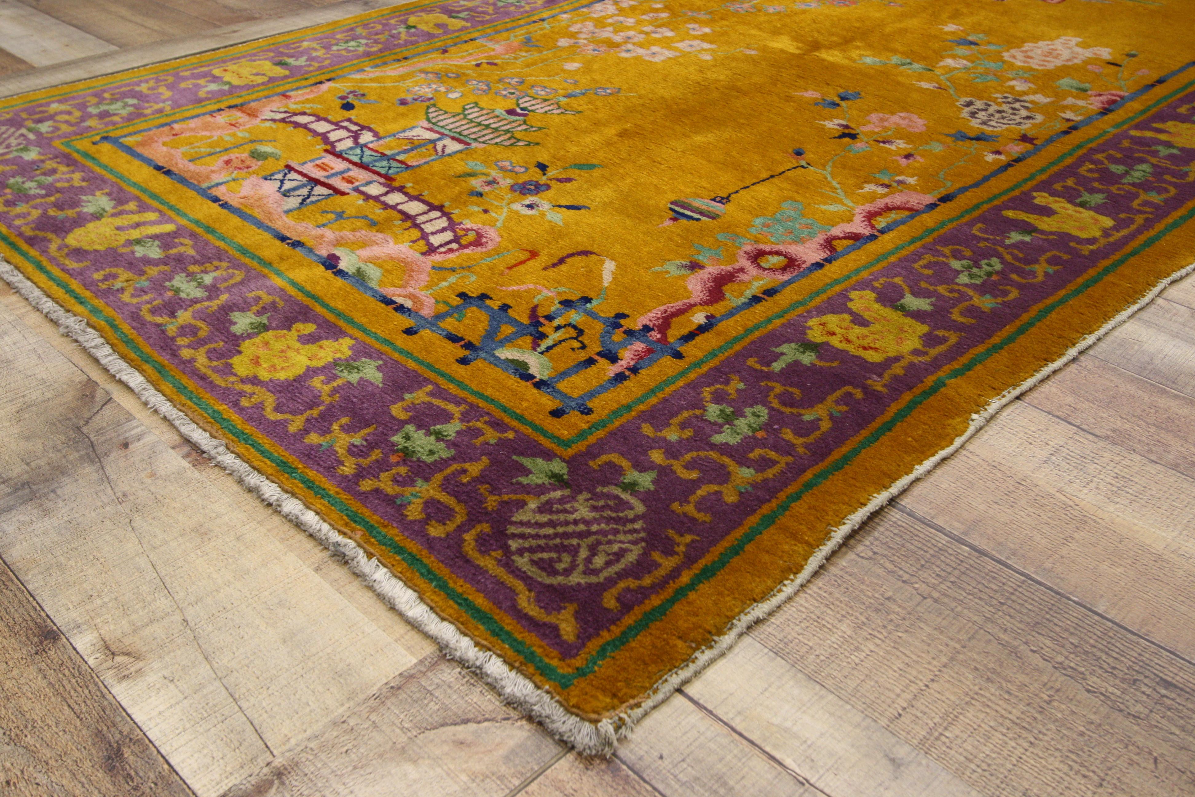 77192 Antique Chinese Peking rug with Pagoda and Chinese Art Deco Style. This hand-knotted wool antique Chinese Peking rug features a landscape scene of a pagoda with camel-back bridges and a suspended lantern surrounded by traditional Chinese