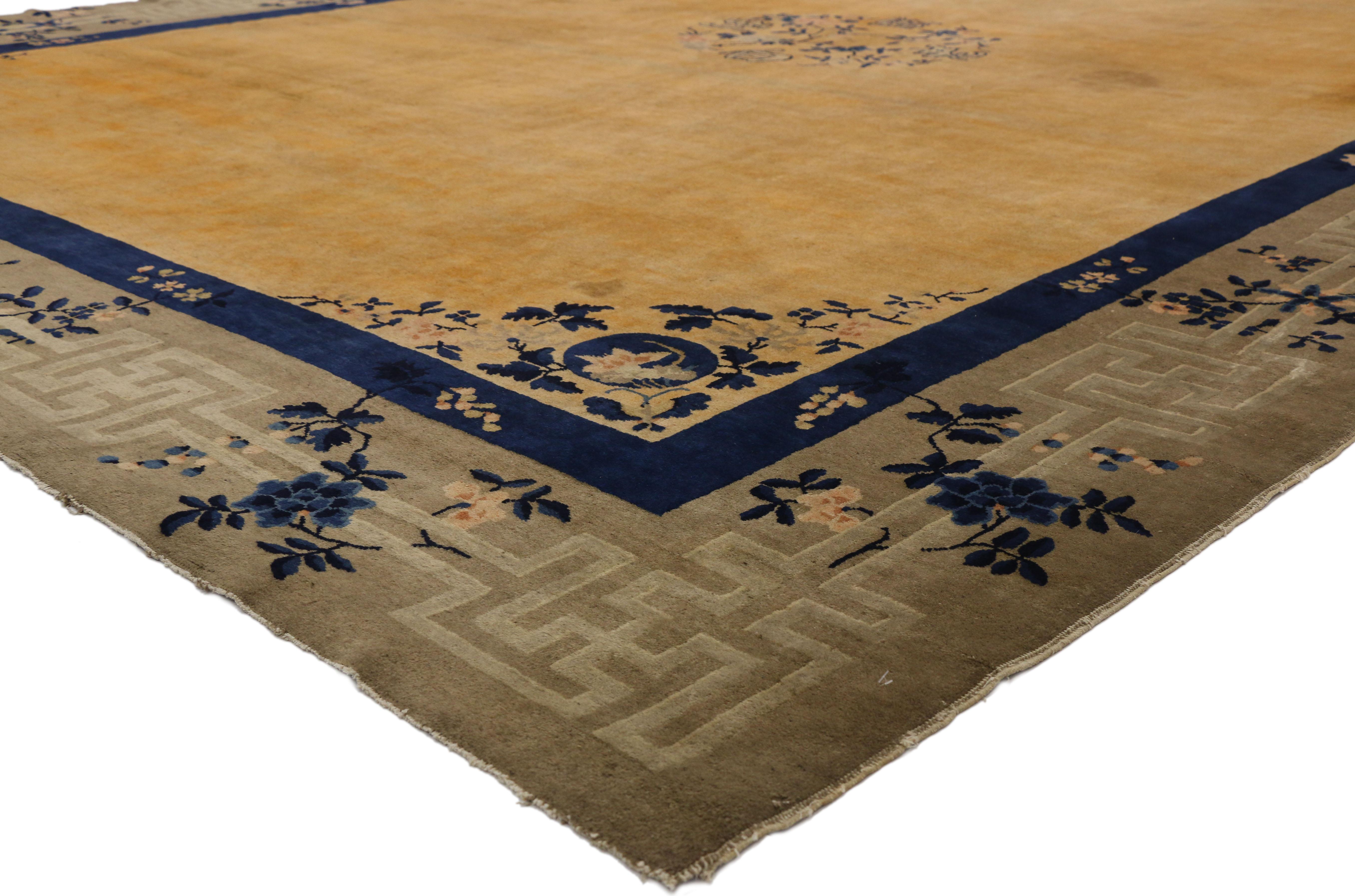 77267 Antique Chinese Peking Wedding Rug with Art Deco Chinoiserie Style. This hand knotted wool antique Chinese Peking rug features a rounded open center medallion floating in the center of a golden yellow field. The medallion is comprised of four
