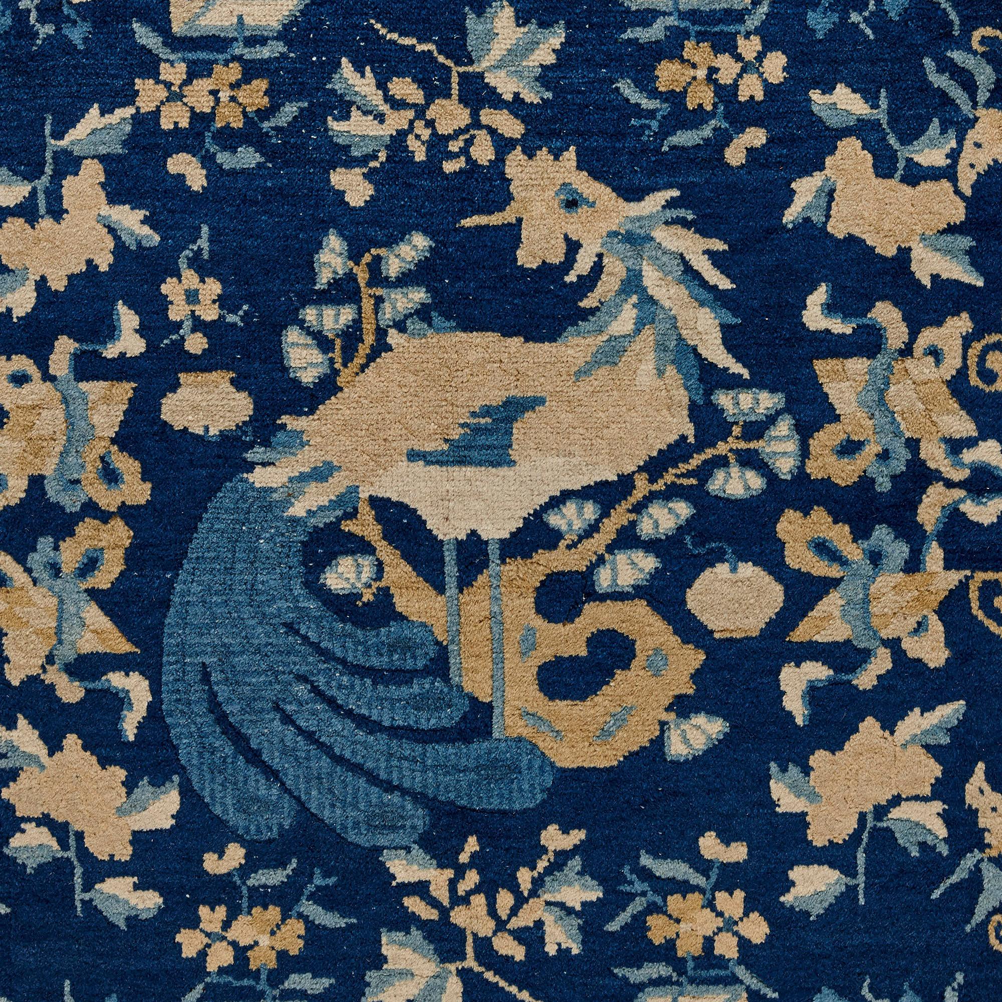 Antique Chinese Peking wool rug
Chinese, c. 1890
Width 268cm, depth 185cm

This find blue-field carpet is from Peking, China, and was created during the last decades of the nineteenth century. The carpet features a rich blue field adorned with