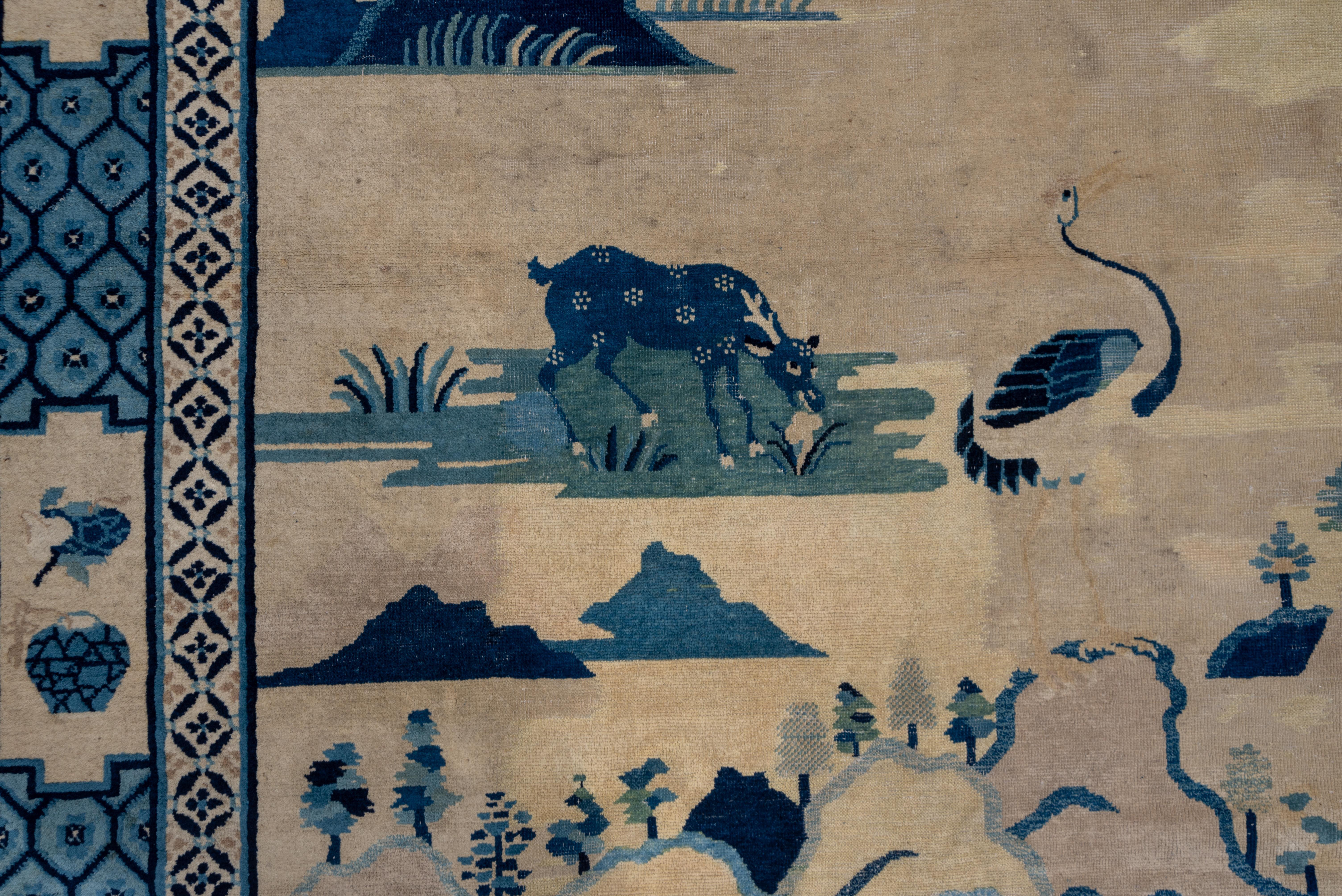 A shan-shui (mountain and water) landscape shows distant, tree-topped mountains, a watery middle distance, and nearby colorfully banded rocks and a rustic dwelling, along with a grazing spotted horse. Cartouches with precious objects against a