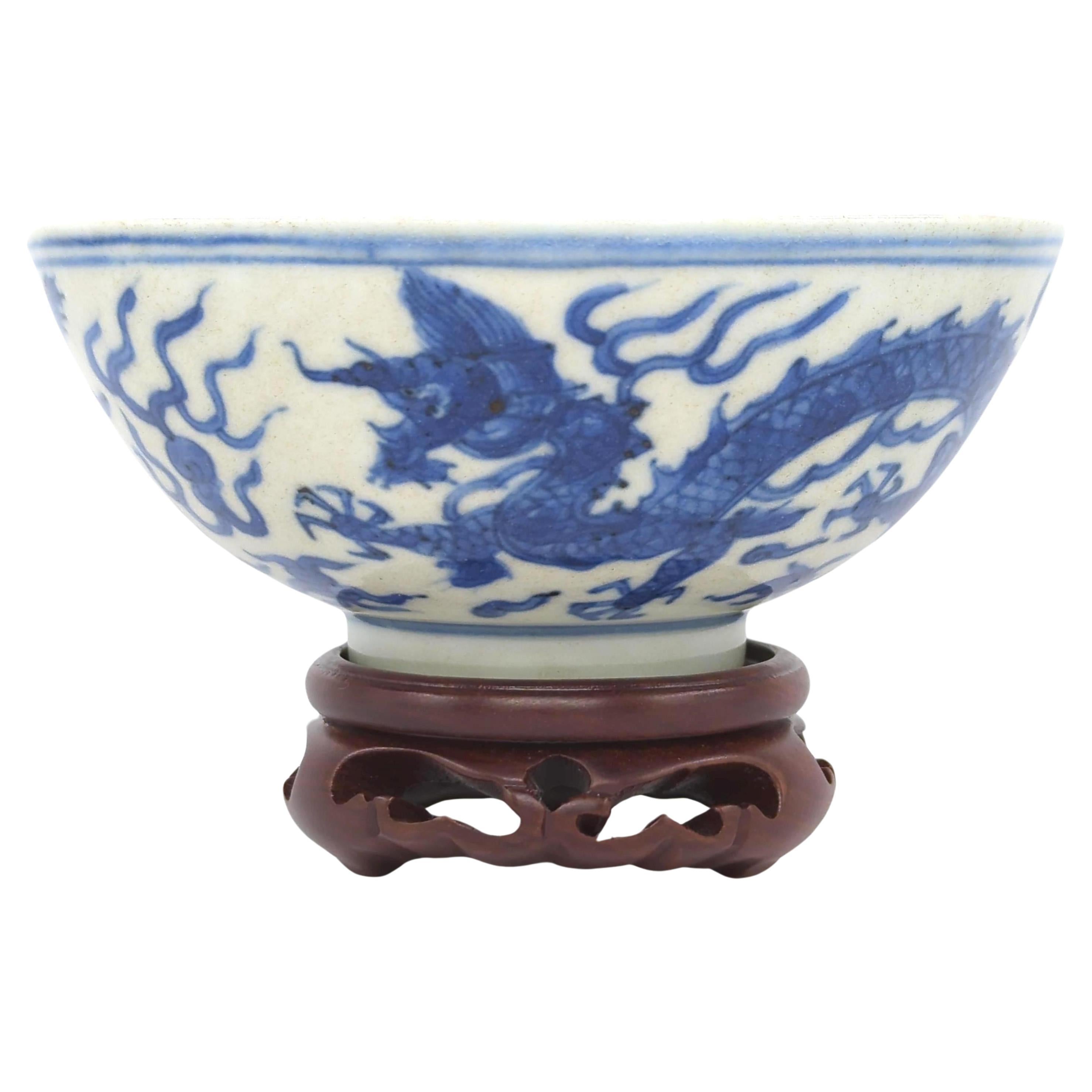 This exceptional blue and white dragon bowl, dating back to the late Ming Dynasty, is a remarkable piece from  an unique period in Chinese porcelain manufacturing known as 