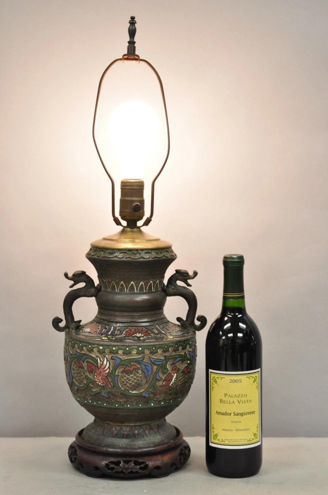 Antique Chinese Porcelain Enamel Bronze Oriental Cloisonne Champleve Table Lamp with Bronze Figural Handles. Circa Early 20th Century. Measurements: 24.5