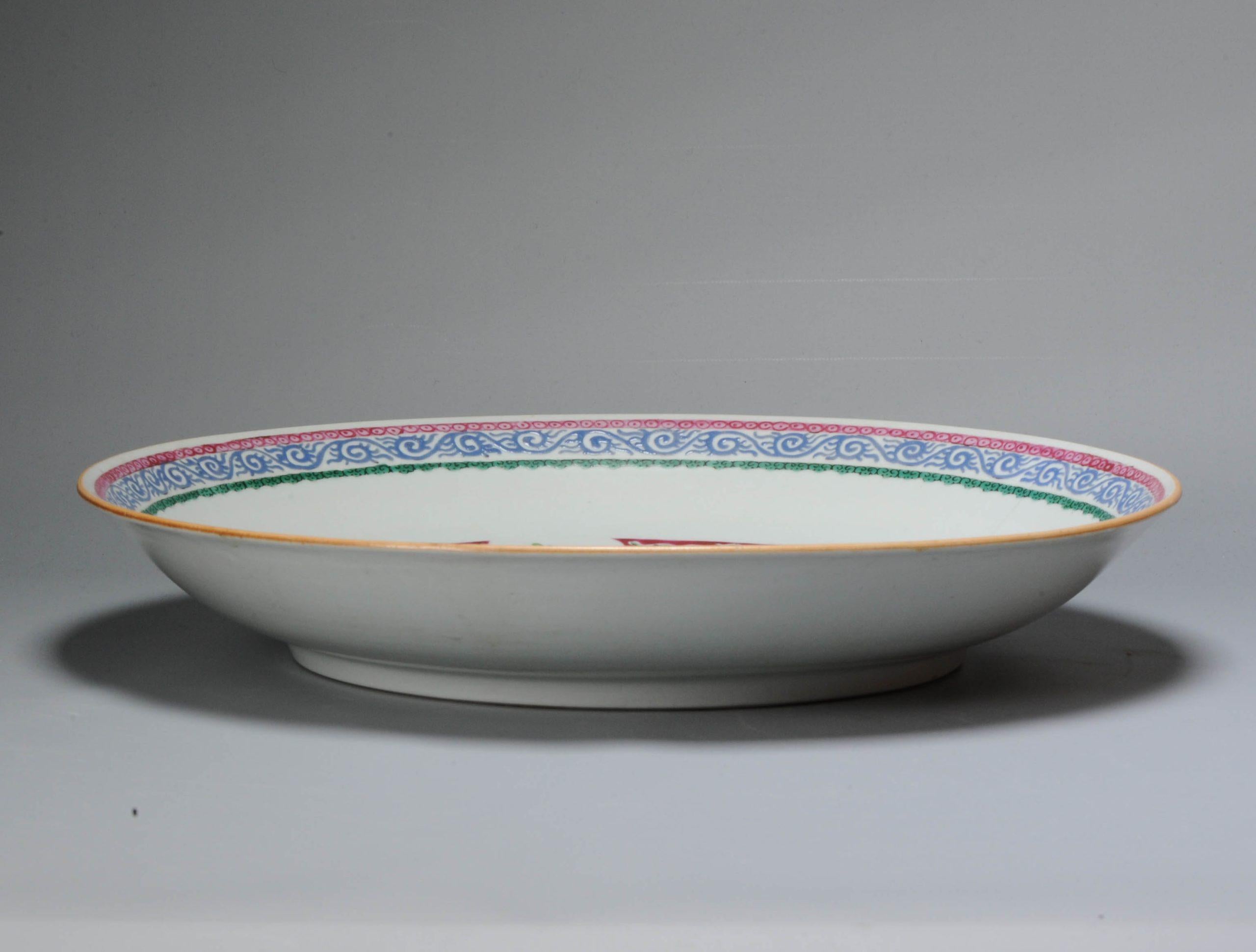 Very happy with the arrival of this larger sized dish from the later 18th century. These dishes were made for the South-East Asian market and are usually very colorful. We have had many examples in the past but not yet with this scene, also with the