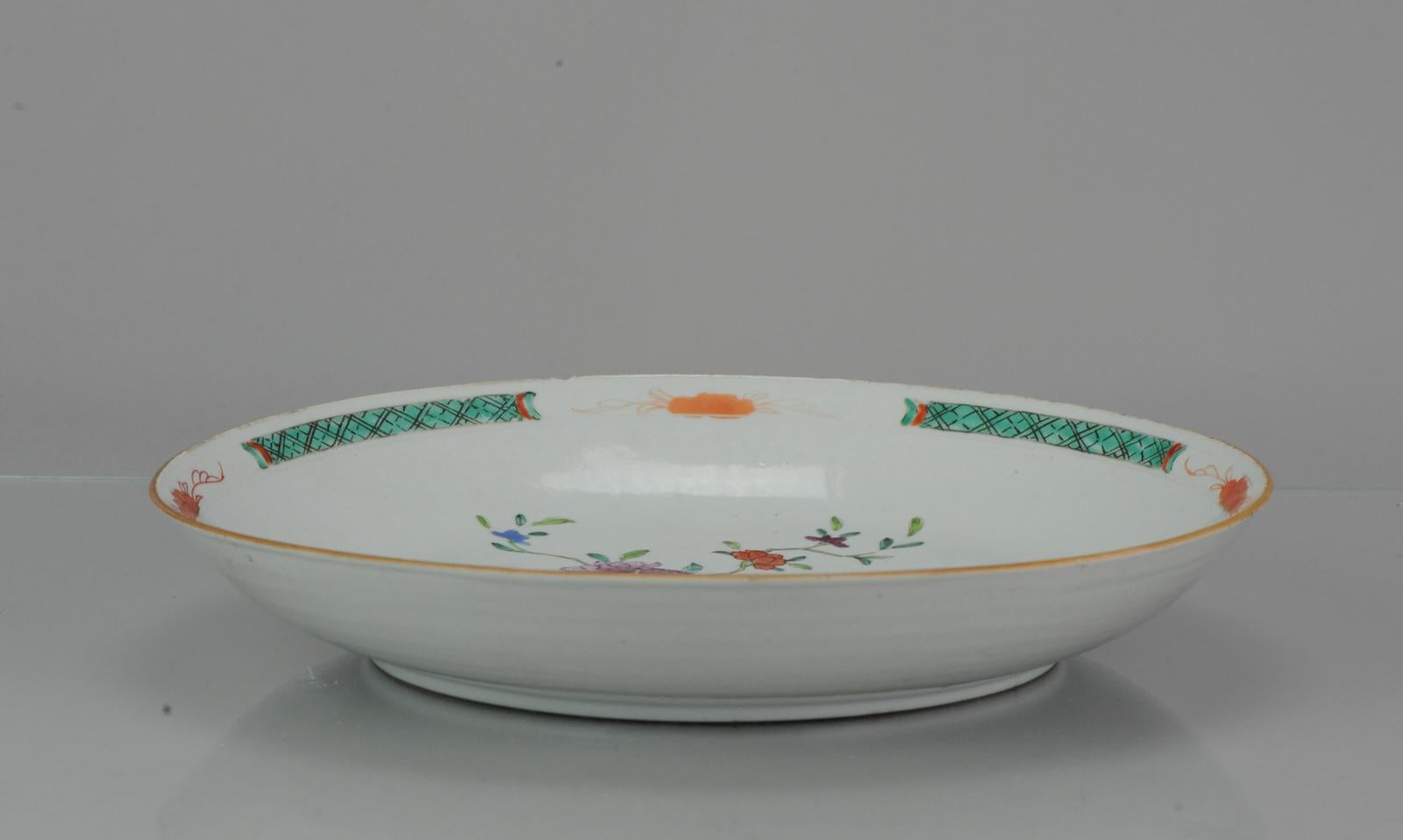 Lovely Chinese Porcelain Famille Rose Charger with nice green, red, blue and pink enamels.

We think it could be a pre Bencharong / Pre Nyonya plate/charger. We call this style Pre Bencharong because it has many features of later bencharong / south