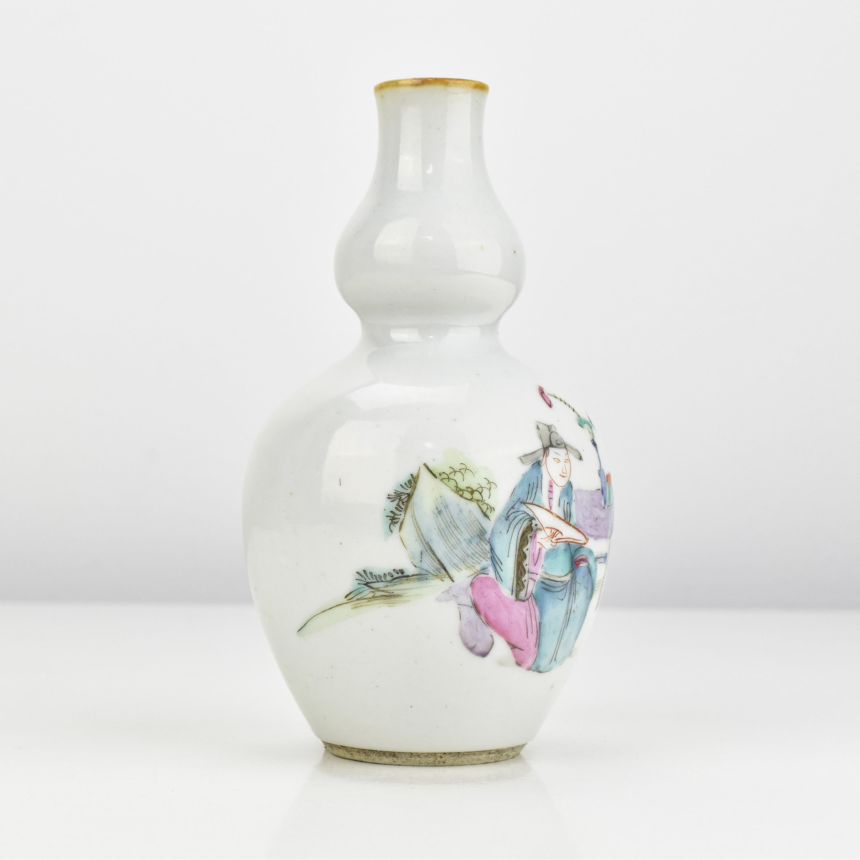 Antique Chinese Famille Rose Vase with Hand-Painted Enamels Qing Dynasty

This lovely small antique Chinese Famille Rose vase hails from the late 19th century and is crafted from fine porcelain, it showcases intricately hand-painted enamels of three