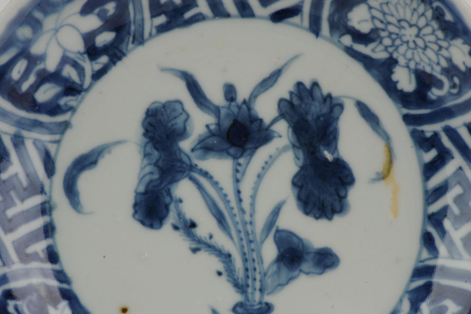 A very nicely decorated dish with a scene of flowers and geometric designs in the border.

Jingdezhen porcelain.

Additional information:
Material: Porcelain & Pottery
Color: Blue & White
Emperor: Plates
Style: Tianqi (1620-1627), Wanli