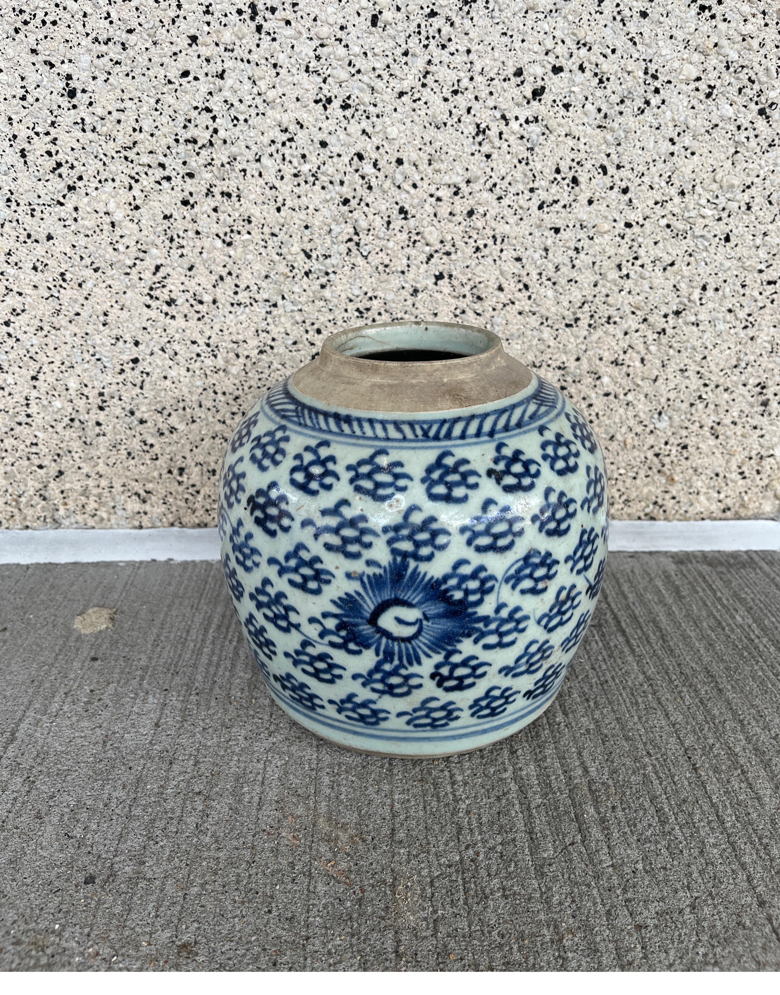 A classic, antique Chinese porcelain jar, circa 1850. This unusual, hand painted piece evokes it's mid-19th Century period, yet fits in and enhances a contemporary interior. This heavy porcelain jar literally glows on a shelf, punching well above