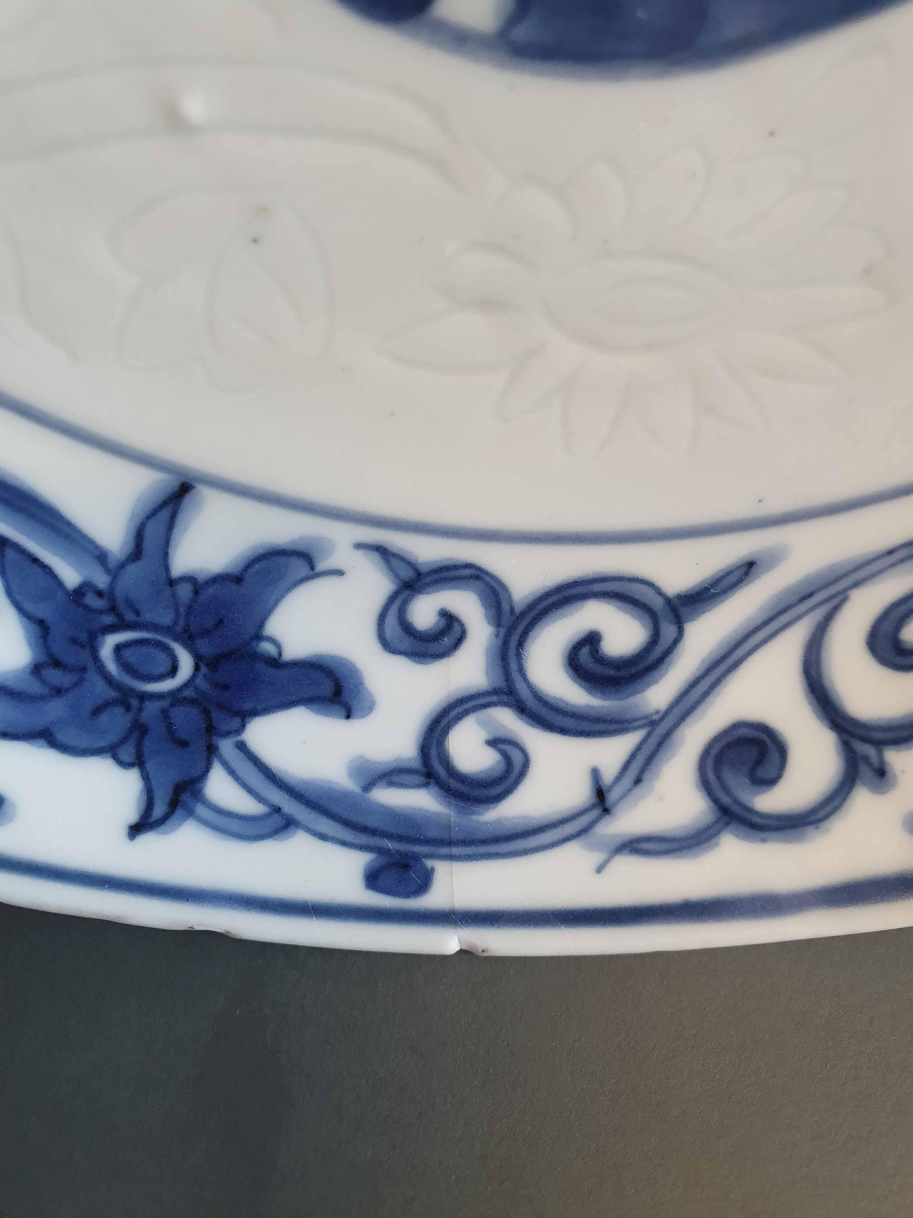 Description
A Blue & White Kosometsuke plate with a lovely scene of a lotus and hidden engraved anhua decoration of flowers in the white aera. Just Superb!

Condition
3 Chips, 1 line and typical rimfritting/mushikui. Size 215 x 40 mm D X
