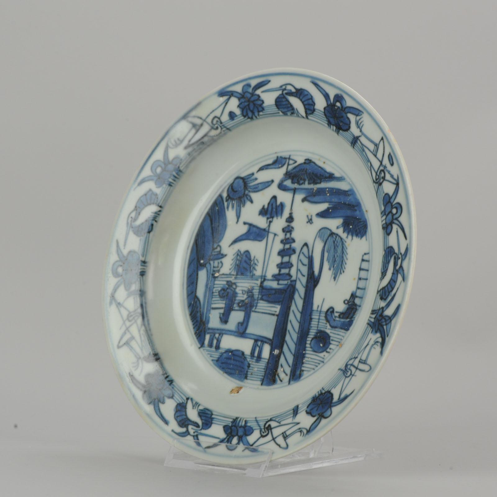 The typical landscape scene of the Jiajing & Wanli period. With a border decorated with cranes. A very nice example!

There are many references to this scene. For Example: Reference: 