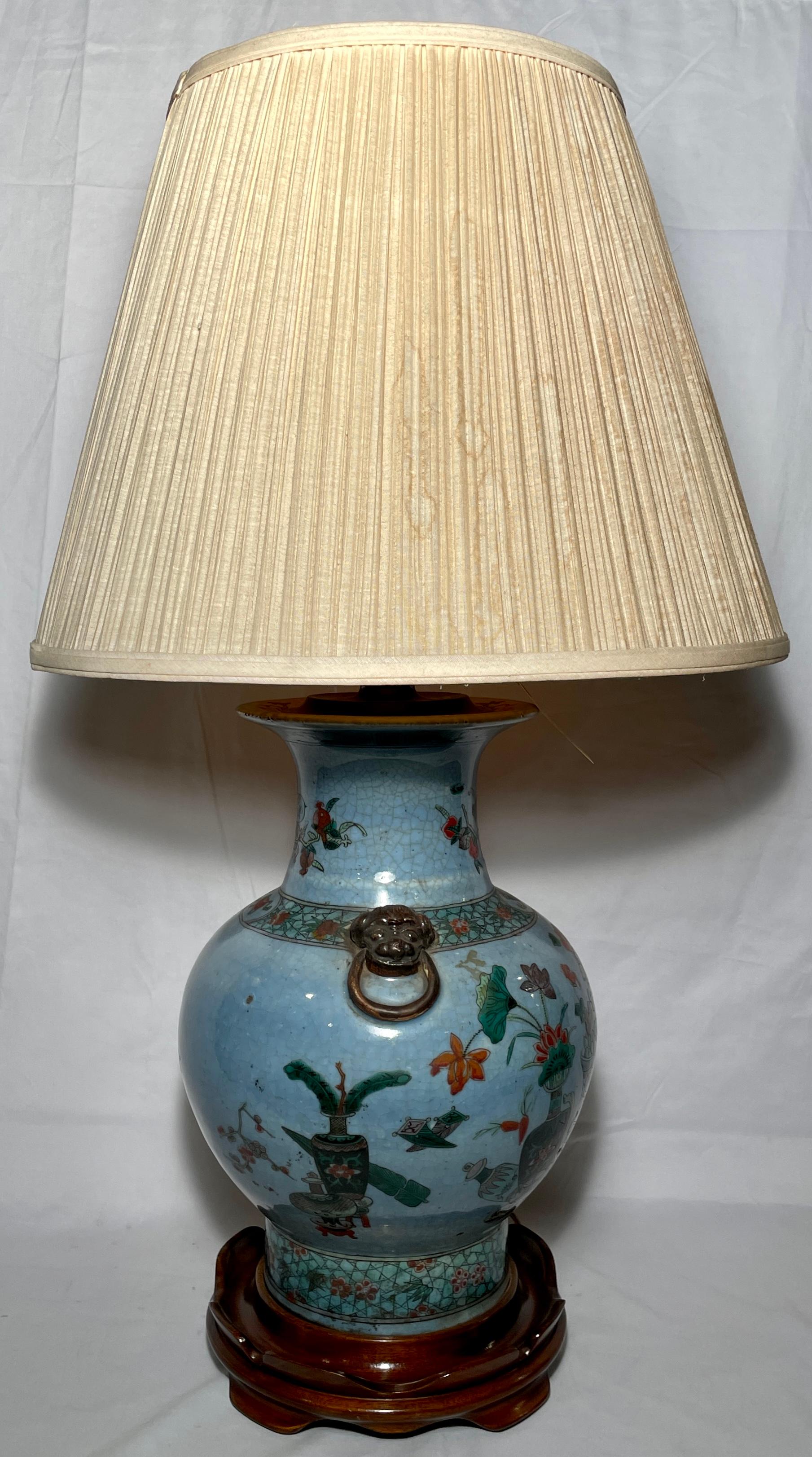 Antique late 19th century Chinese porcelain vase which was later converted into lamp on a custom made mahogany base. 
Measurements:
Lamp shade- 18.25 inches in diameter 
Body- 10 inches in diameter 
Base- 9 inches in diameter.