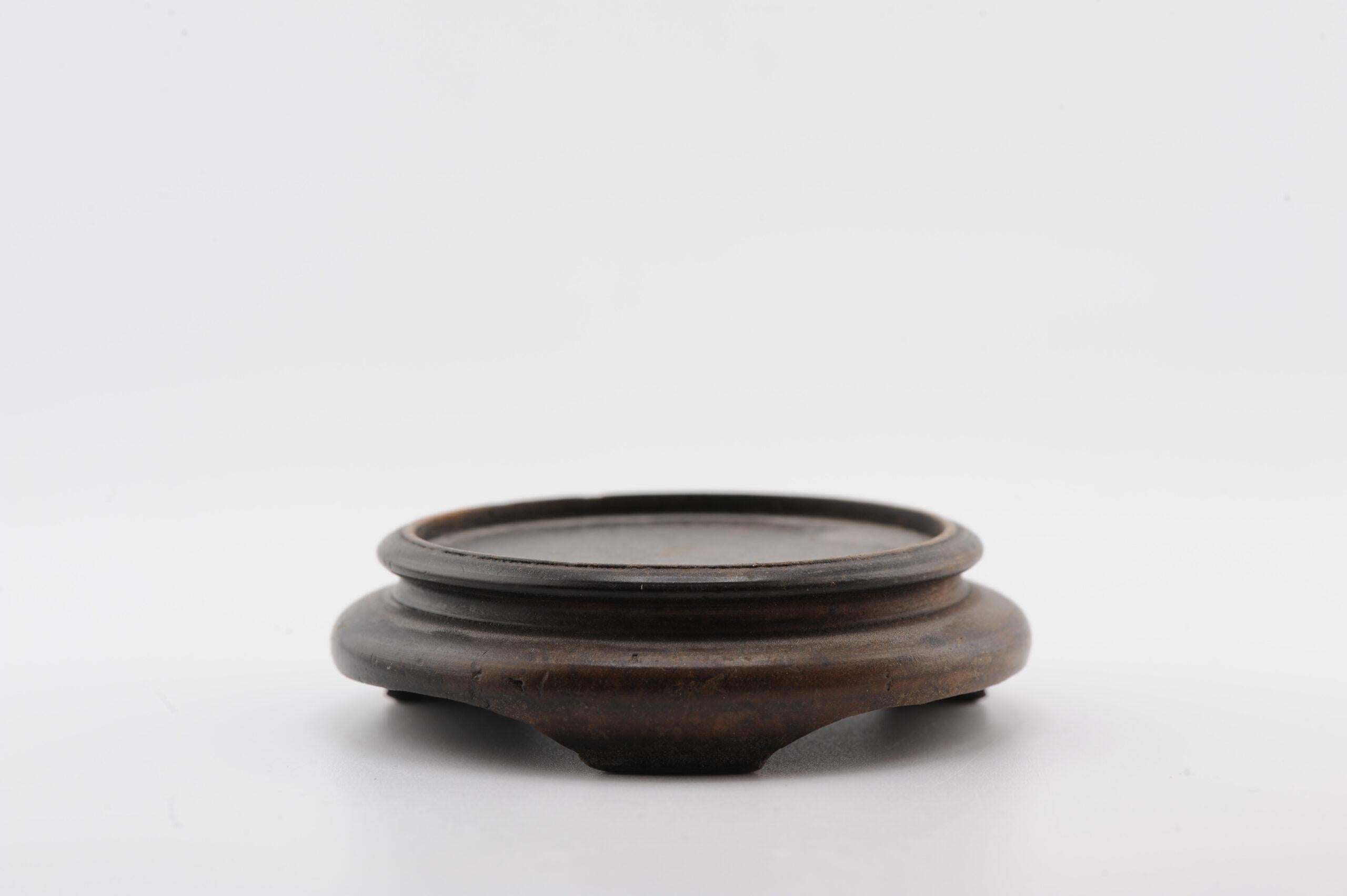 Here we have a nice wooden stand

Additional information:
Material: Porcelain & Pottery
Type: Stand
Region of Origin: China 
Period: 19th c / early 20th c
Condition: A bit worn
Dimension: Surface: 5.2cm