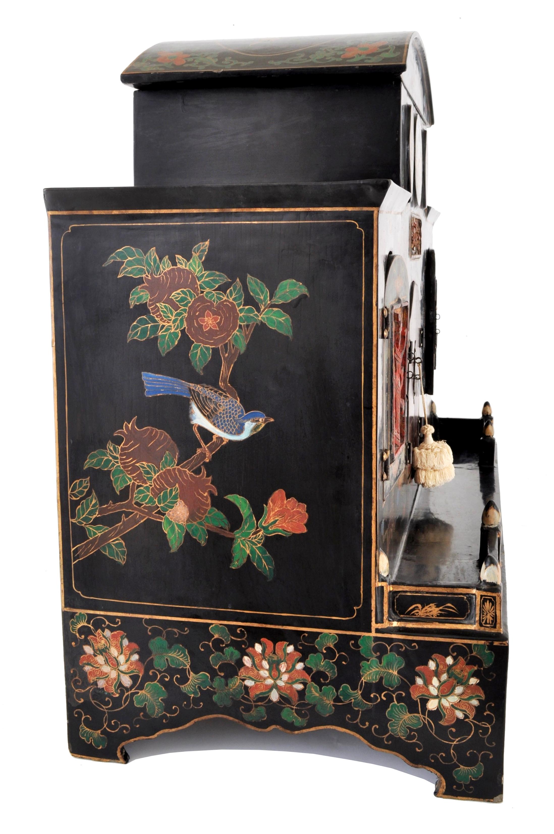 Antique Chinese Qing dynasty Buddhistic shrine/cabinet, circa 1900. The shrine having a domed removable top with a storage reservoir below, the cabinet is lavishly decorated and hand painted with cranes, clouds, bats, and other symbols of good