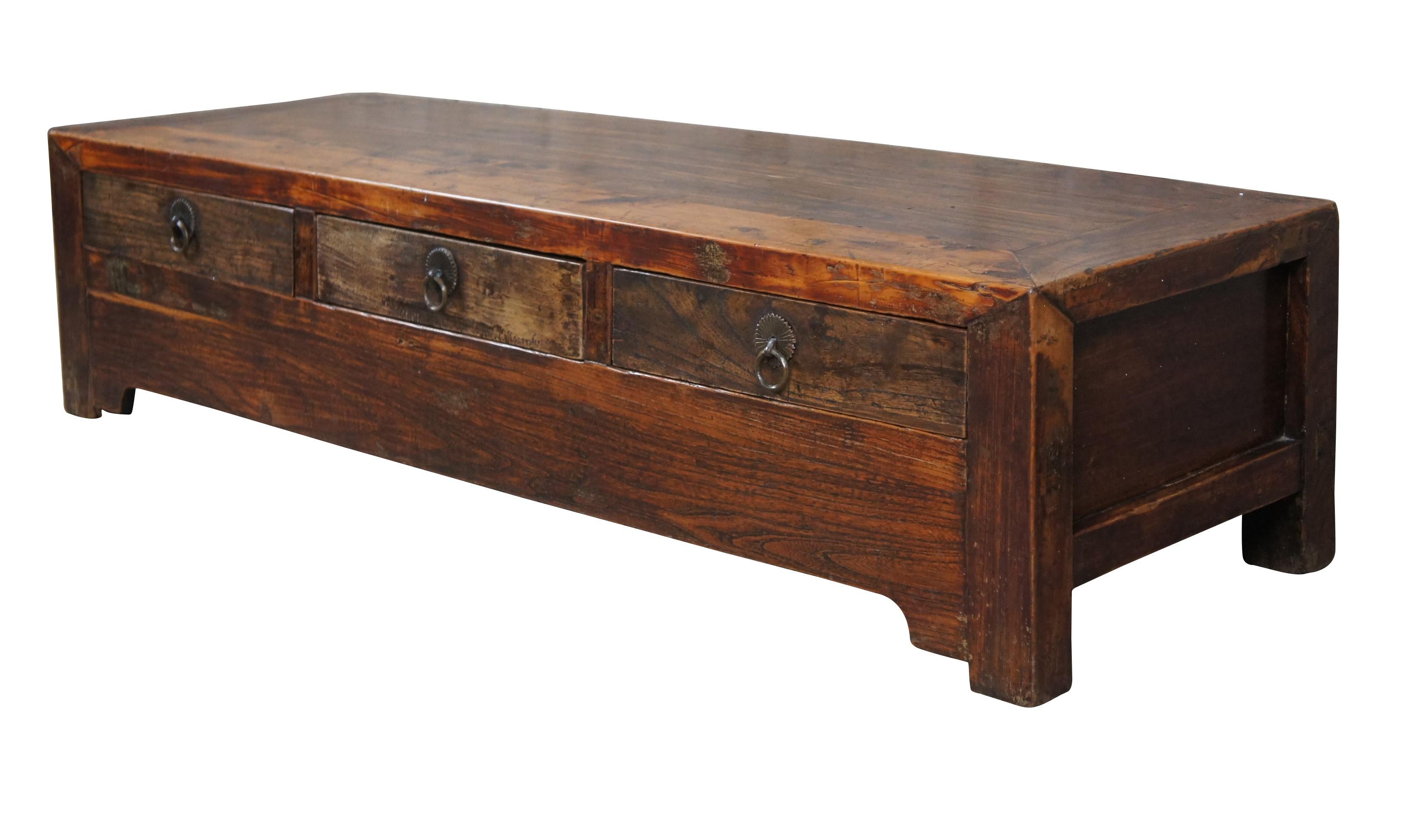 Antique Chinese Qing Dynasty Ming inspired console or coffee table, circa 1870s. A rectangular form made from Elm in mortise and tenon construction with inset panels. Includes three hand dovetailed drawers with brass hardware. A versatile piece that