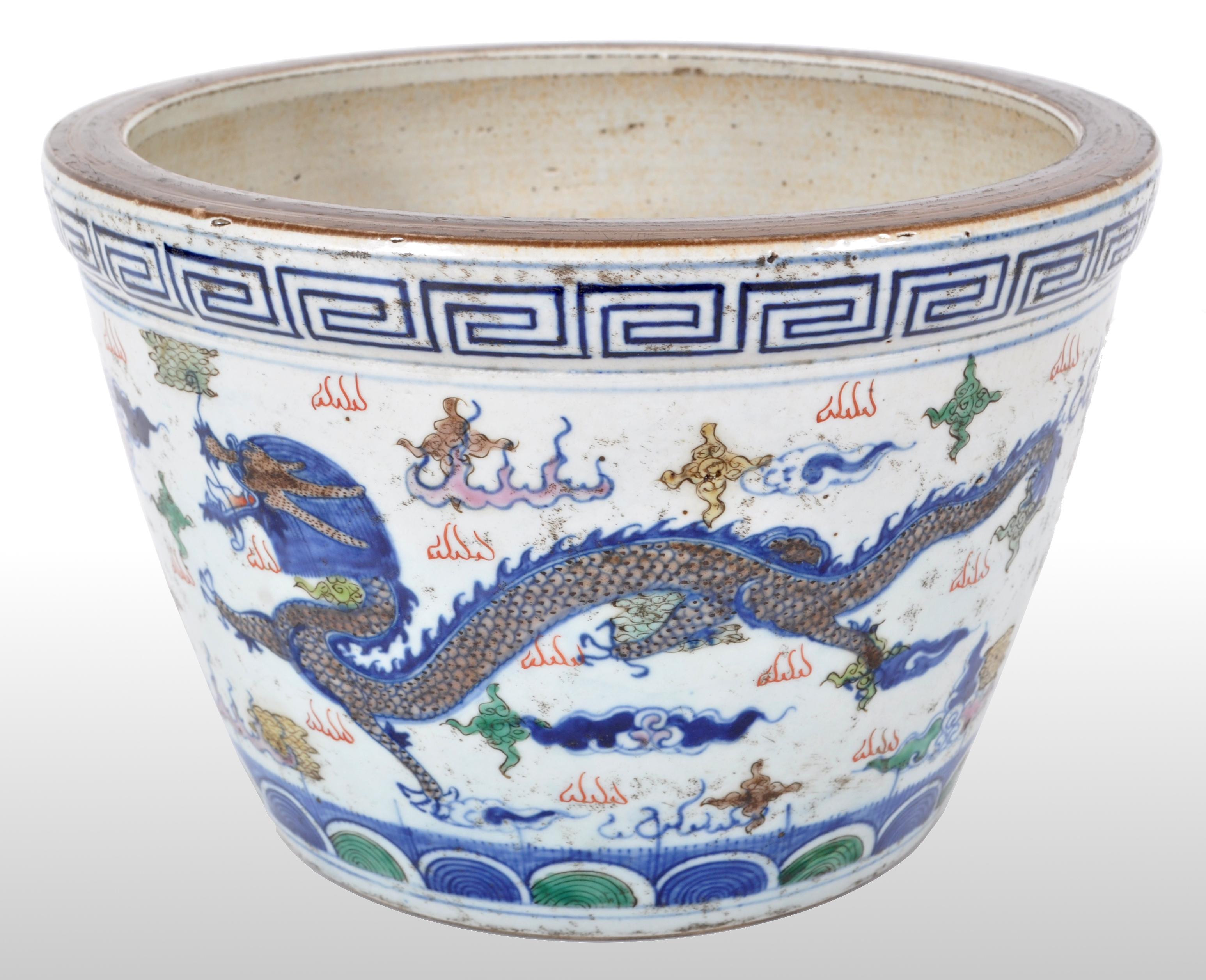 A good antique Chinese transitional porcelain Wucai (five colors) censer from the great kilns of Jingdezhen and dating from the reign of the Kangxi Emperor, (1662-1722). The censer is finely decorated with a pair of dragons chasing a flaming pearl