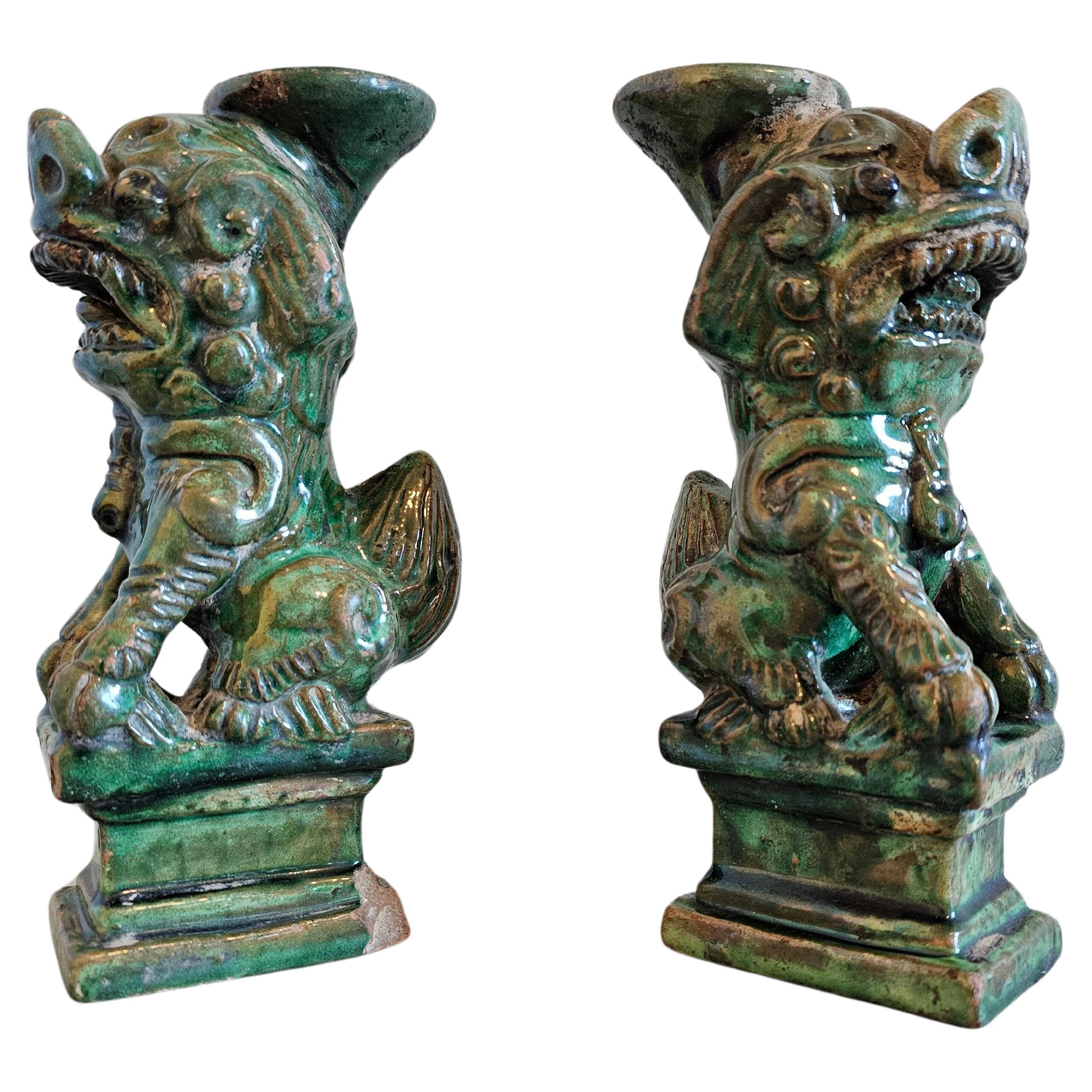 A whimsical pair of late Qing Dynasty (1636-1912) Chinese pottery Sancai green glazed joss stick incense holders. circa 1890

Born in China around the turn of the late 19th / early 20th century, exceptionally executed small sculptural form, modeled