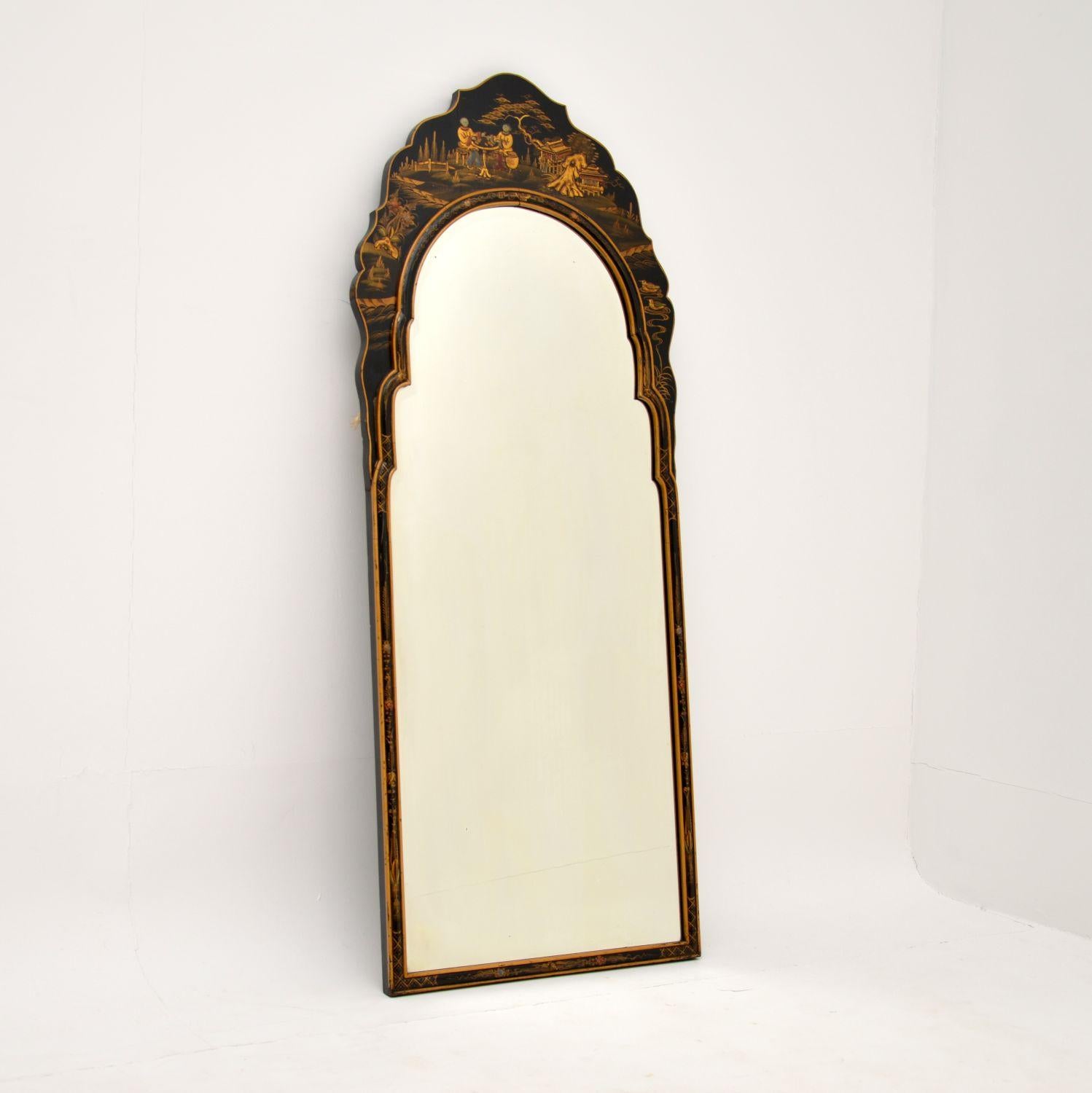 A stunning antique Queen Anne style lacquered chinoiserie mirror, with Chinese influence. This was made in England, it dates from around the 1920’s period.

The quality is fabulous, the black lacquered wood frame has stunning paintings in mostly