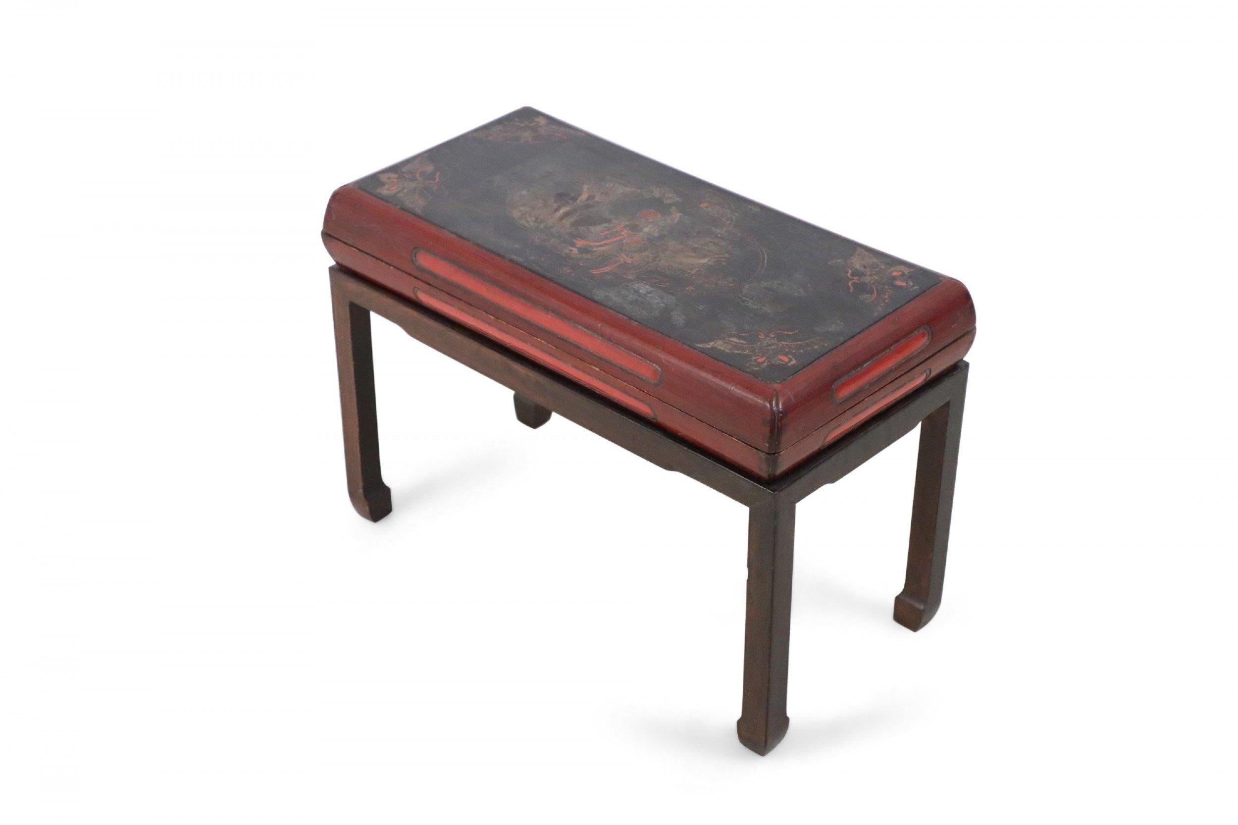 Antique Chinese (Early Republic) wooden bench with removeable, red-sided, black two-piece top painted in a gold and red central figurative scene and moths in each corner, supported by a wooden frame with square legs.