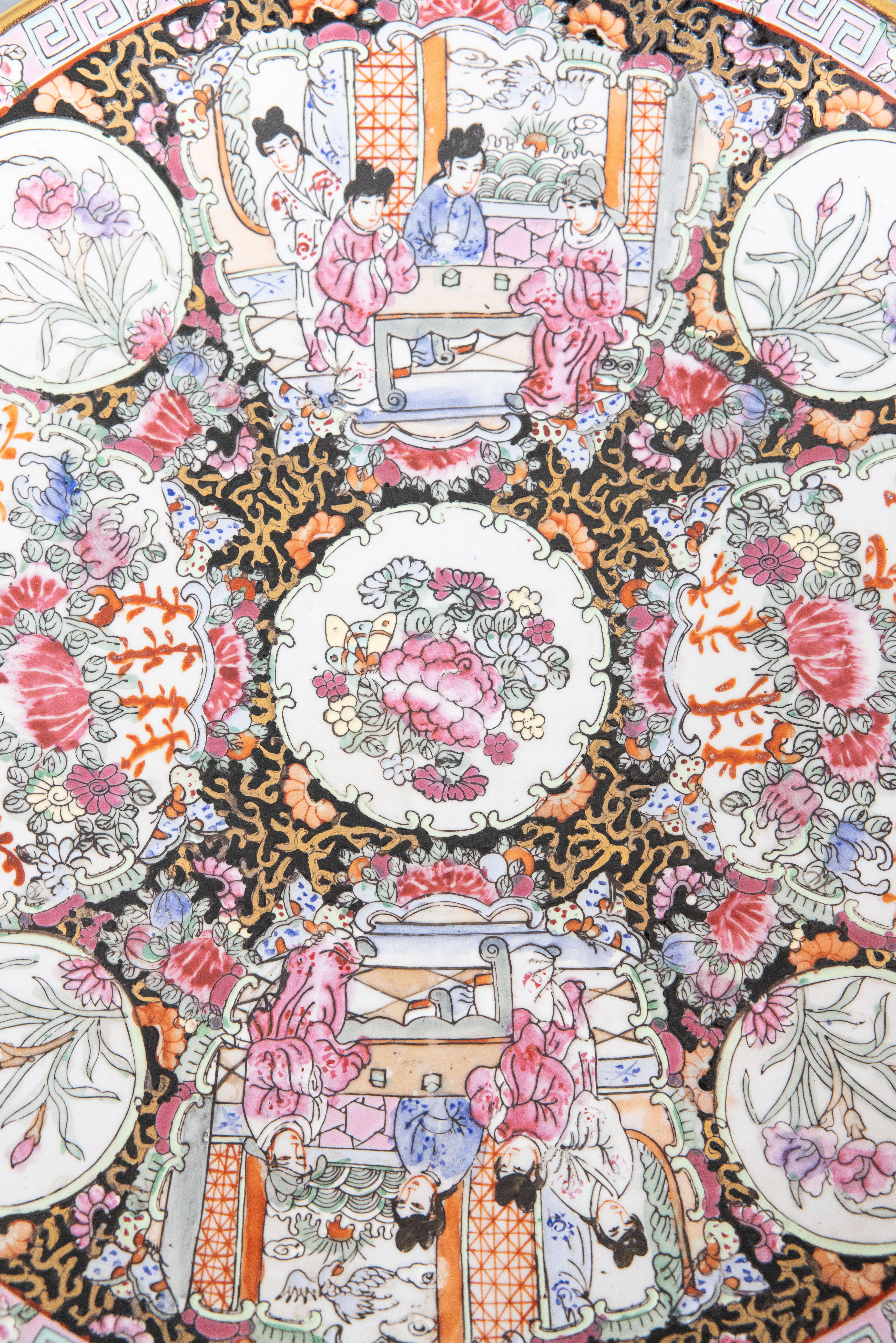 A stunning antique early 20th Century Chinese Export famille rose porcelain charger plate. Maker's mark on reverse. This lovely larger charger has gorgeous colors in the traditional Rose Medallion design. It would be perfect hung on a wall or used