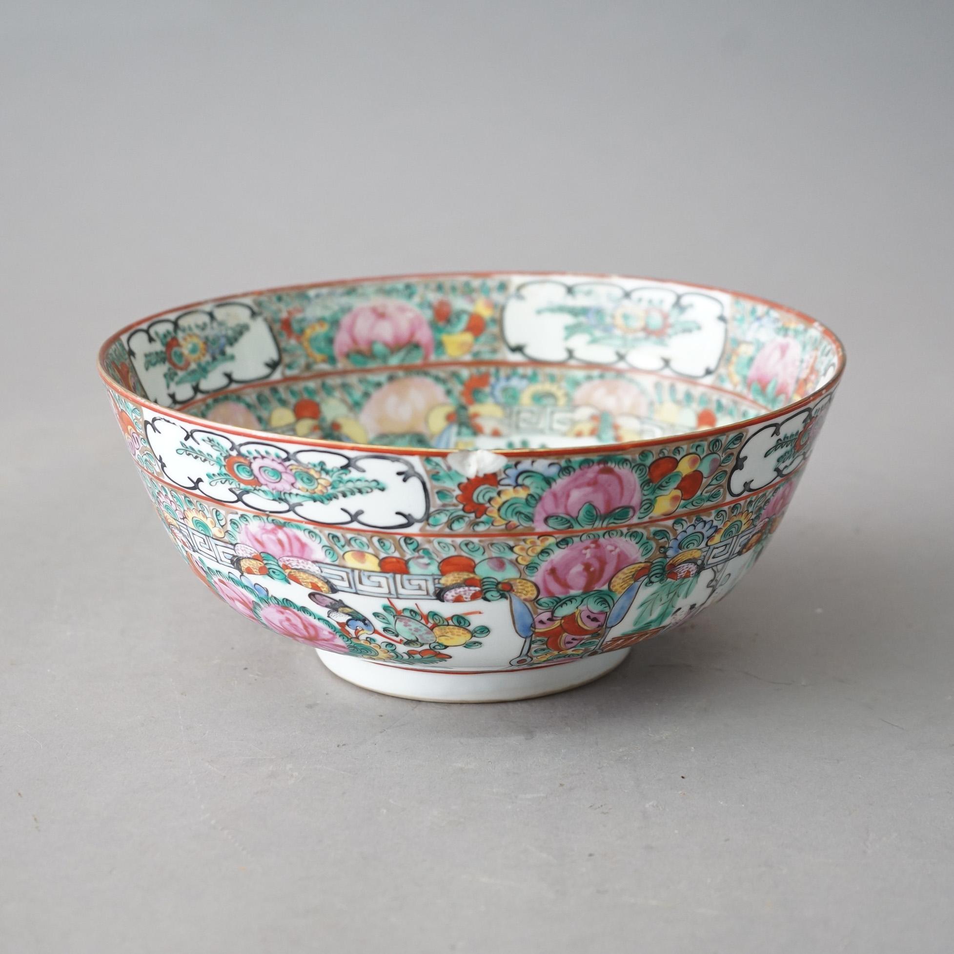 An antique Chinese Rose Medallion bowl offers porcelain construction with paneled genre scenes and garden elements, stamped on base as photographed, c1920

Measures - 4.5