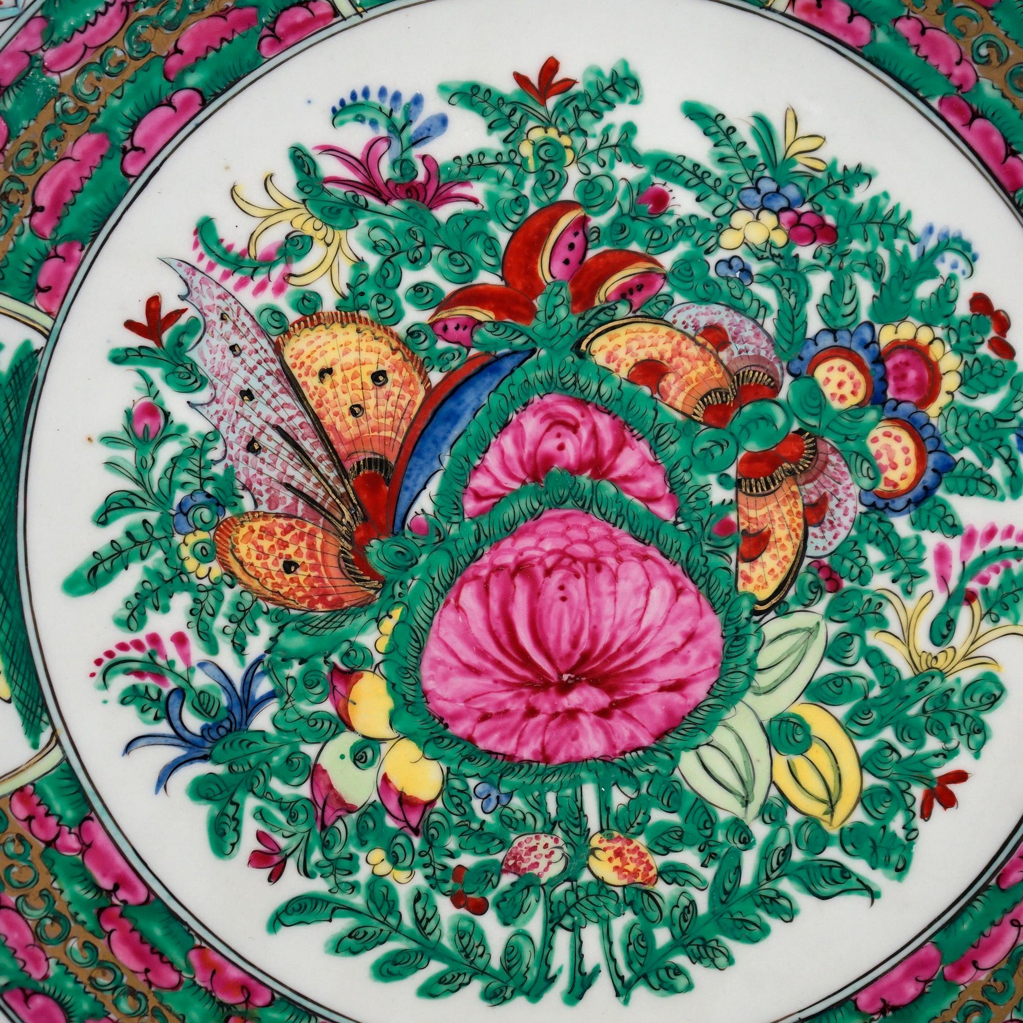 An antique Chinese Rose Medallion charger offers porcelain construction with garden scenes having butterflies and flowers, en verso signed as photographed, c1920.

Measures- 2.25''H x 15''W x 15''D.

Catalogue Note: Ask about DISCOUNTED DELIVERY