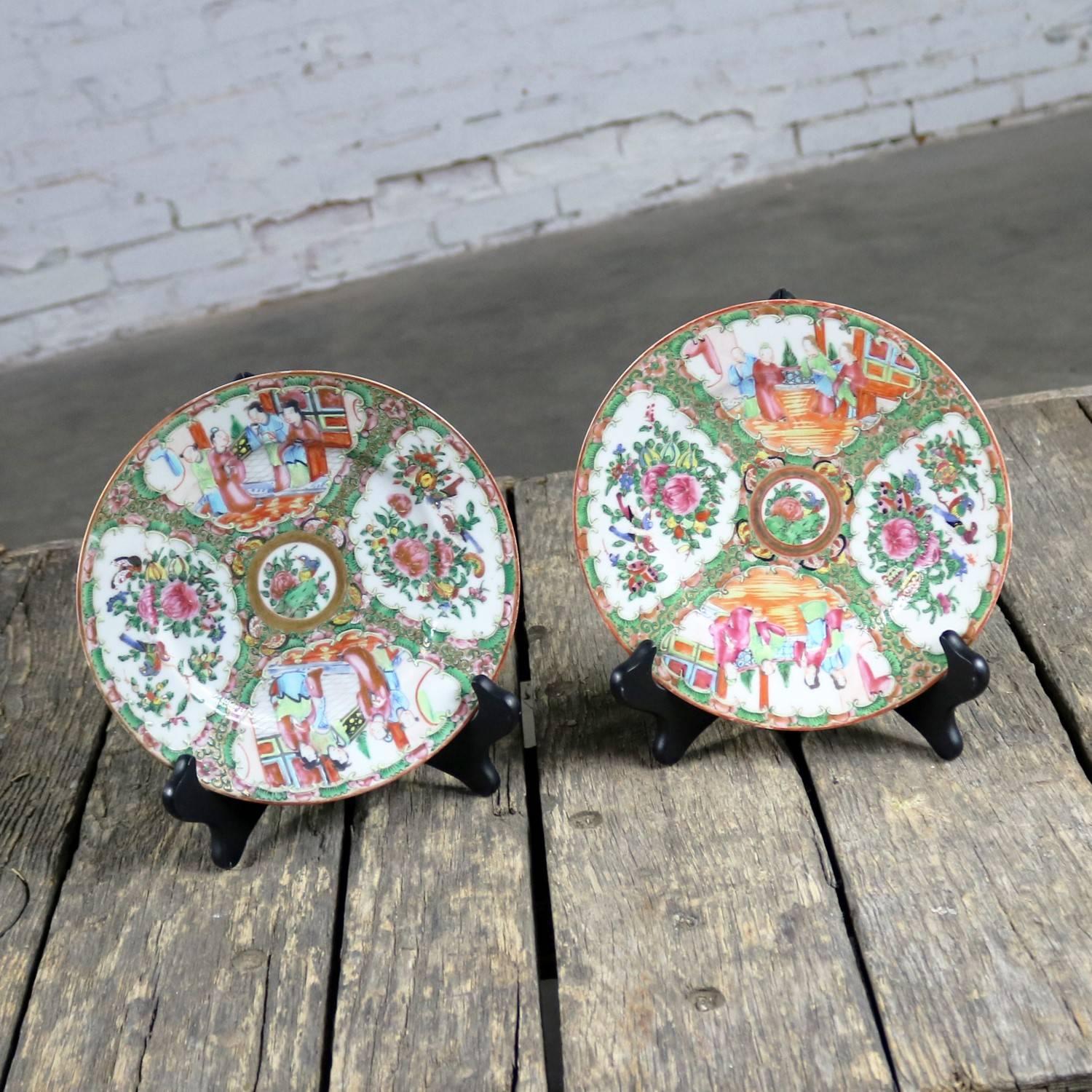 Wonderful set of two antique Chinese Rose Medallion porcelain 8.5-inch plates with a traditional medallion design featuring village scenes and floral and bird panels. Each plate has slight differences in the design. Both plates are in fabulous