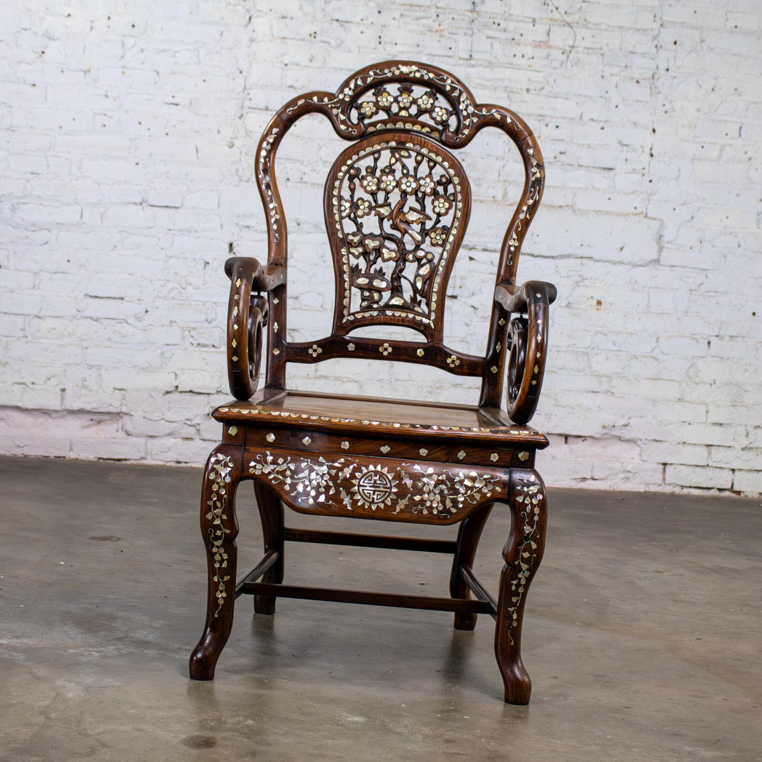 Magnificent vintage Chinese Rosewood armchair with Mother of Pearl inlaid details. Beautiful condition, keeping in mind that this is vintage and not new so will have signs of use and wear even if it has been refinished or restored. Specifically, it