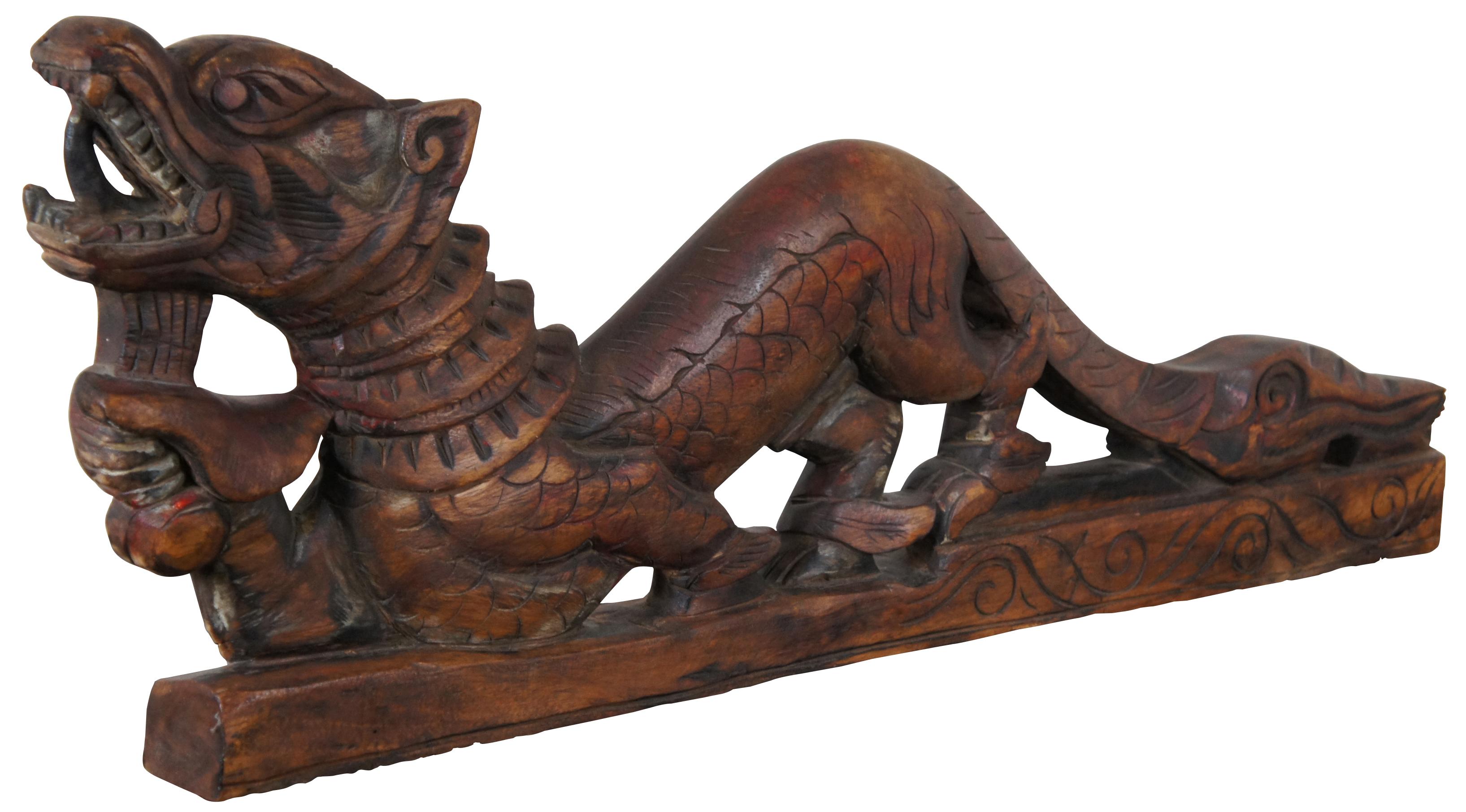Antique rosewood Chinese carved dragon or serpent sculpture. A great pediment or embellishment for use along a table or mounted to a wall as a plaque. Measures: 36