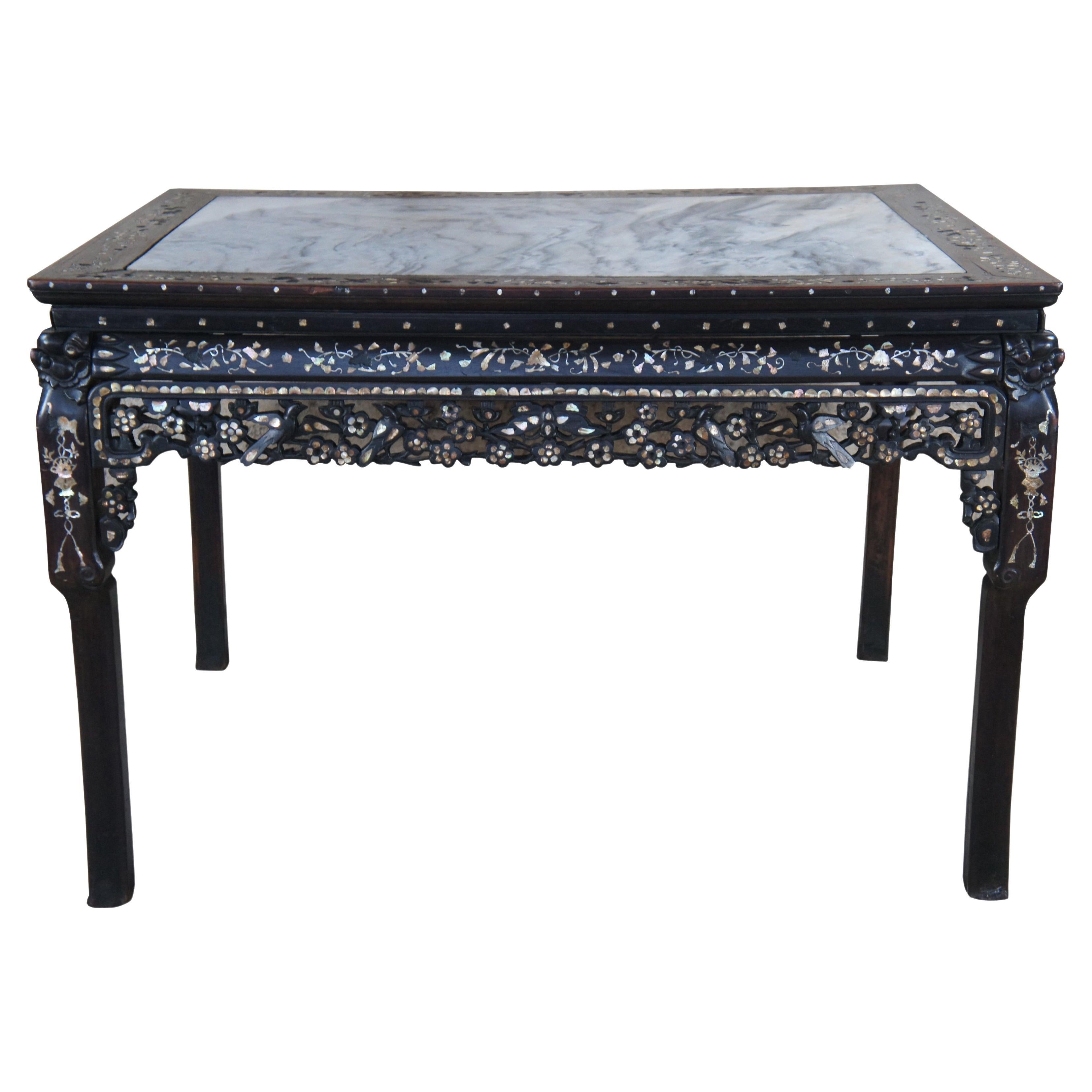 An impressive antique 19th century Mother or Pearly inlaid console, game, dining or center table. A rectangular form made from rosewood with mortise and tenon construction featuring inset gray marble top over a mother-of-pearl inlaid and pierced