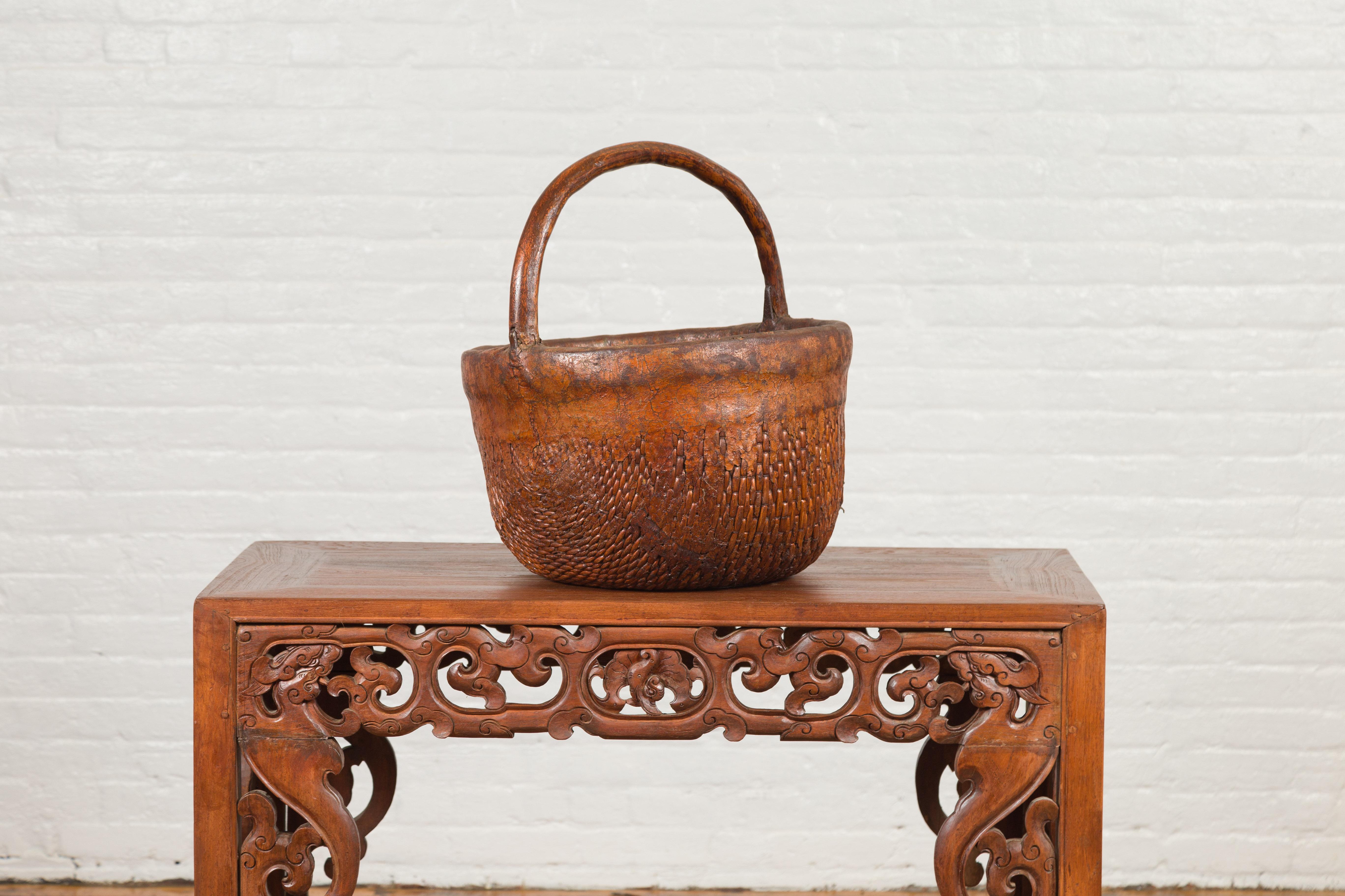 19th Century Antique Chinese Round Carrying Basket with Intricate Woven Rattan Design