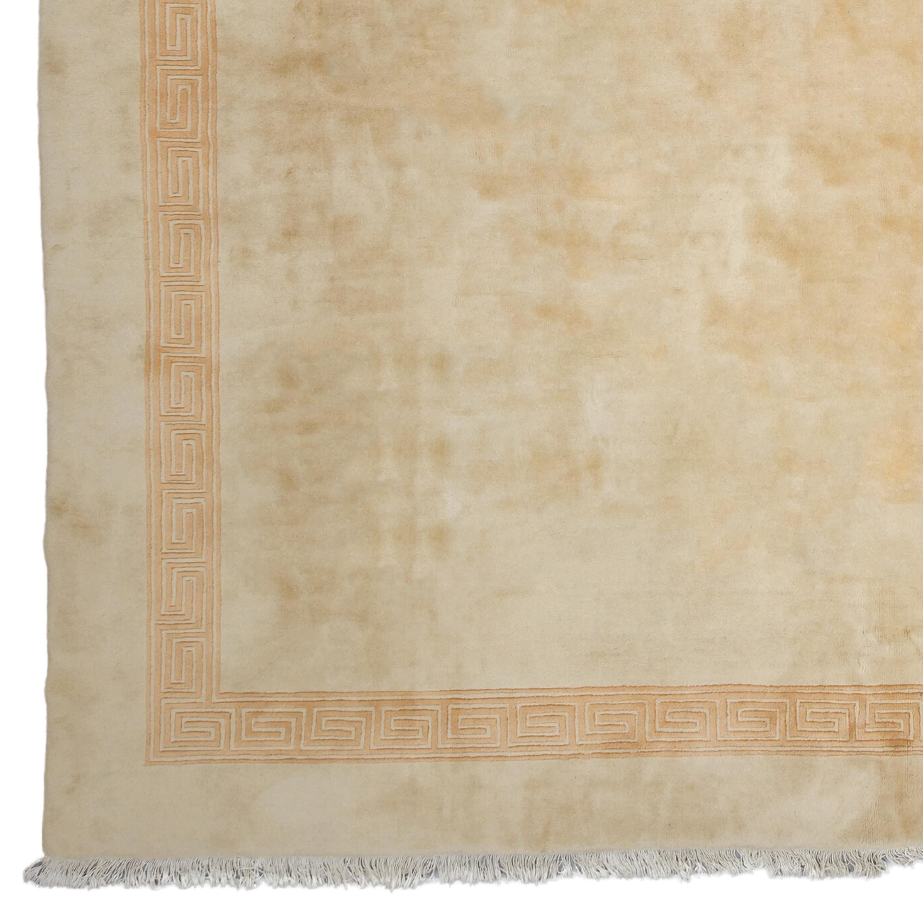 A Work of Art Beyond Time This rare piece is an antique Chinese carpet from the 19th century. It adds nobility to any space with its rich history and sophisticated design. Its silky texture and pale golden tones reflect timeless