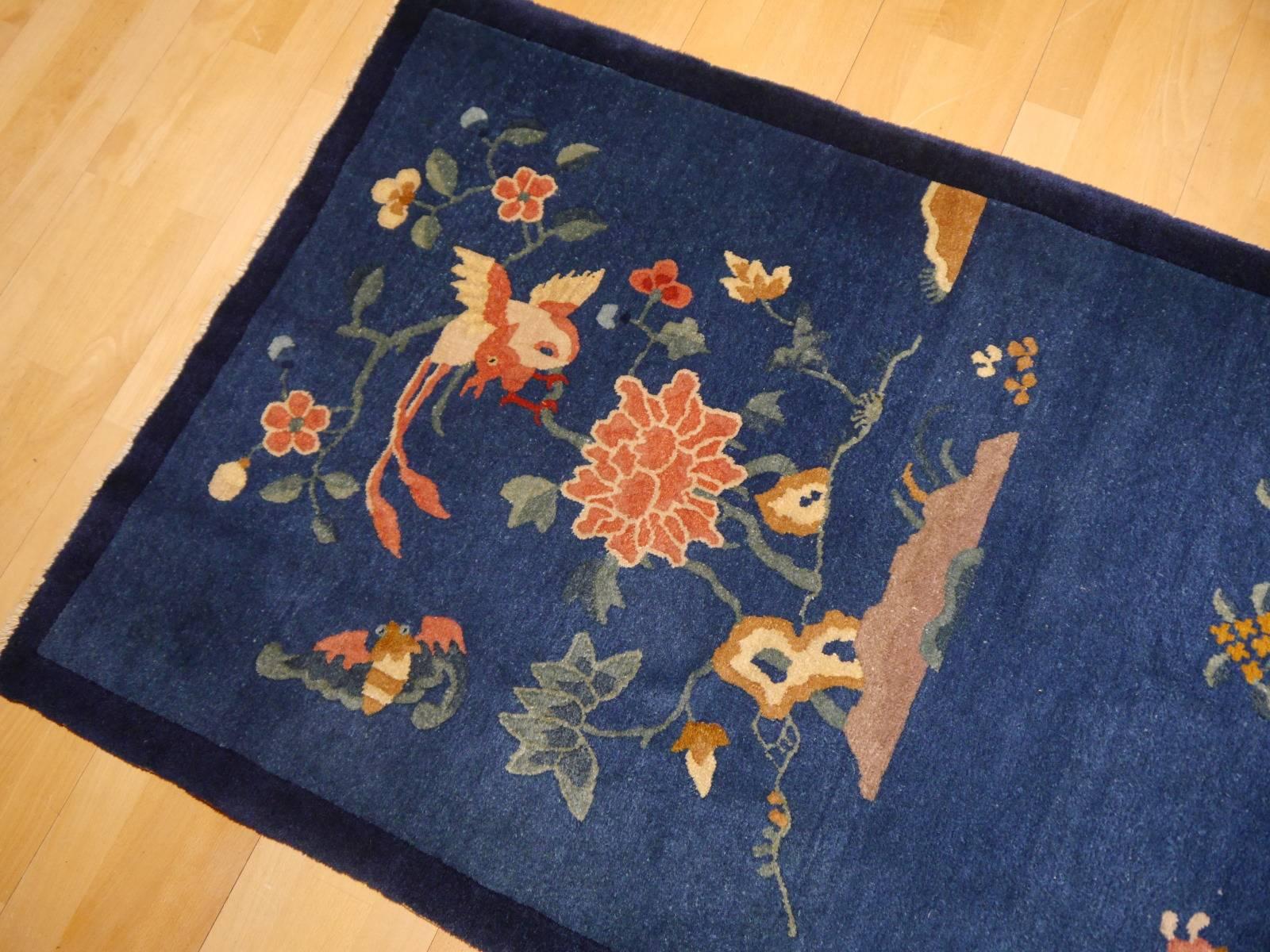 Very beautiful antique Peking Chinese Rug, clear blue Color combination and elegant reduced design. Great condition with high pile and without damages, collectors item.