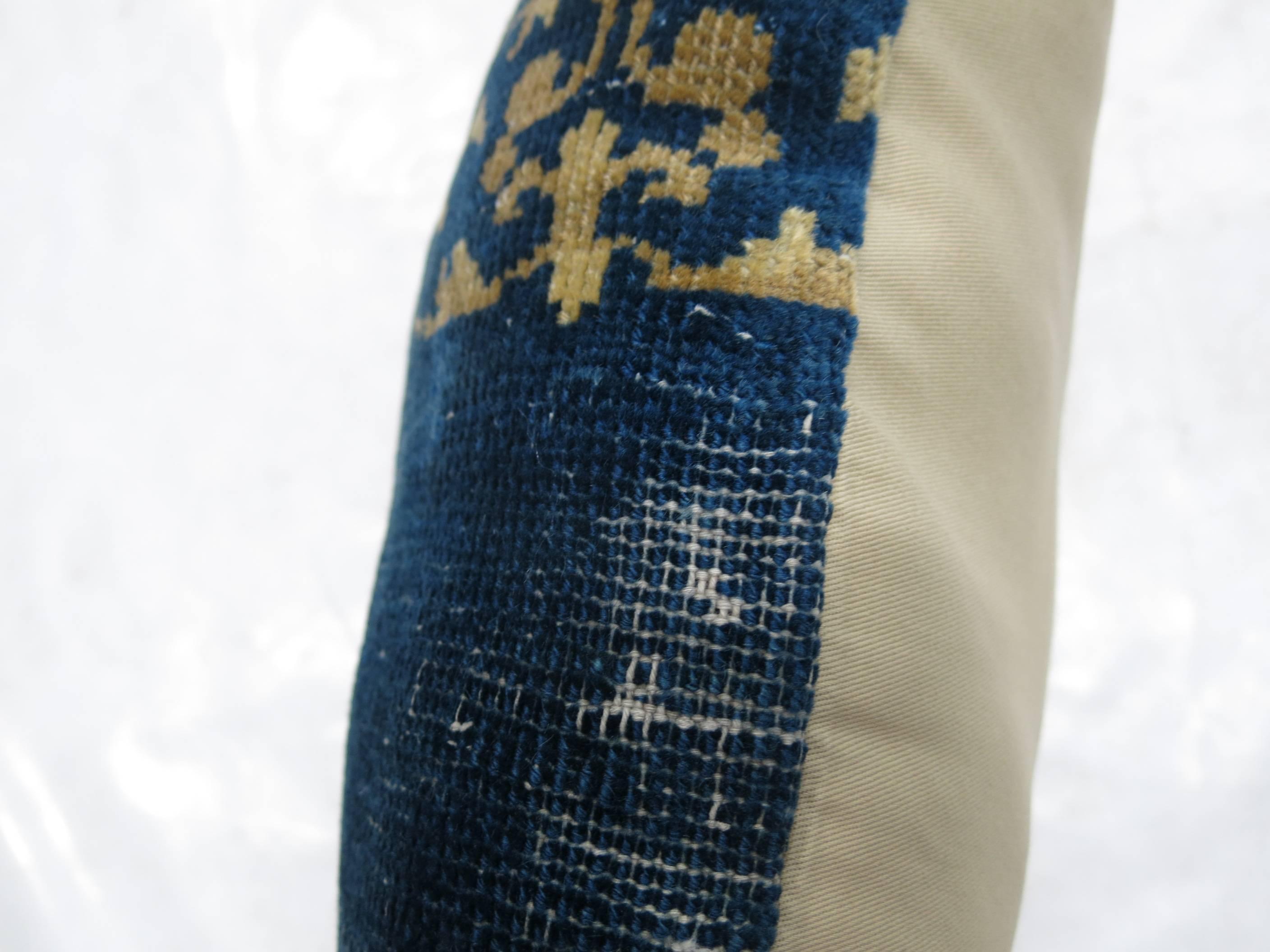 Pillow made from an early 20th century Chinese blue Peking rug.