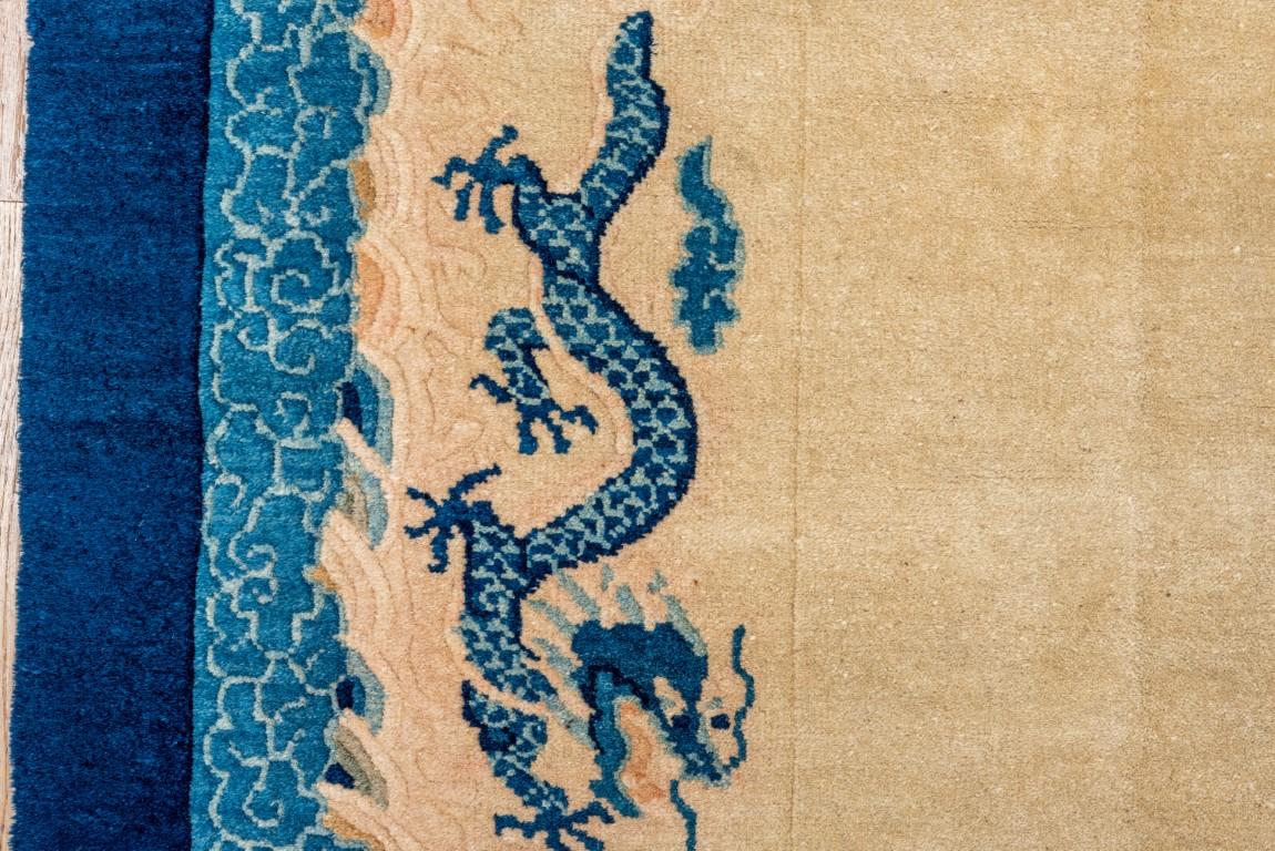 20th Century Antique Chinese Rug with a Straw Field, Blue Border and Blue Dragons For Sale