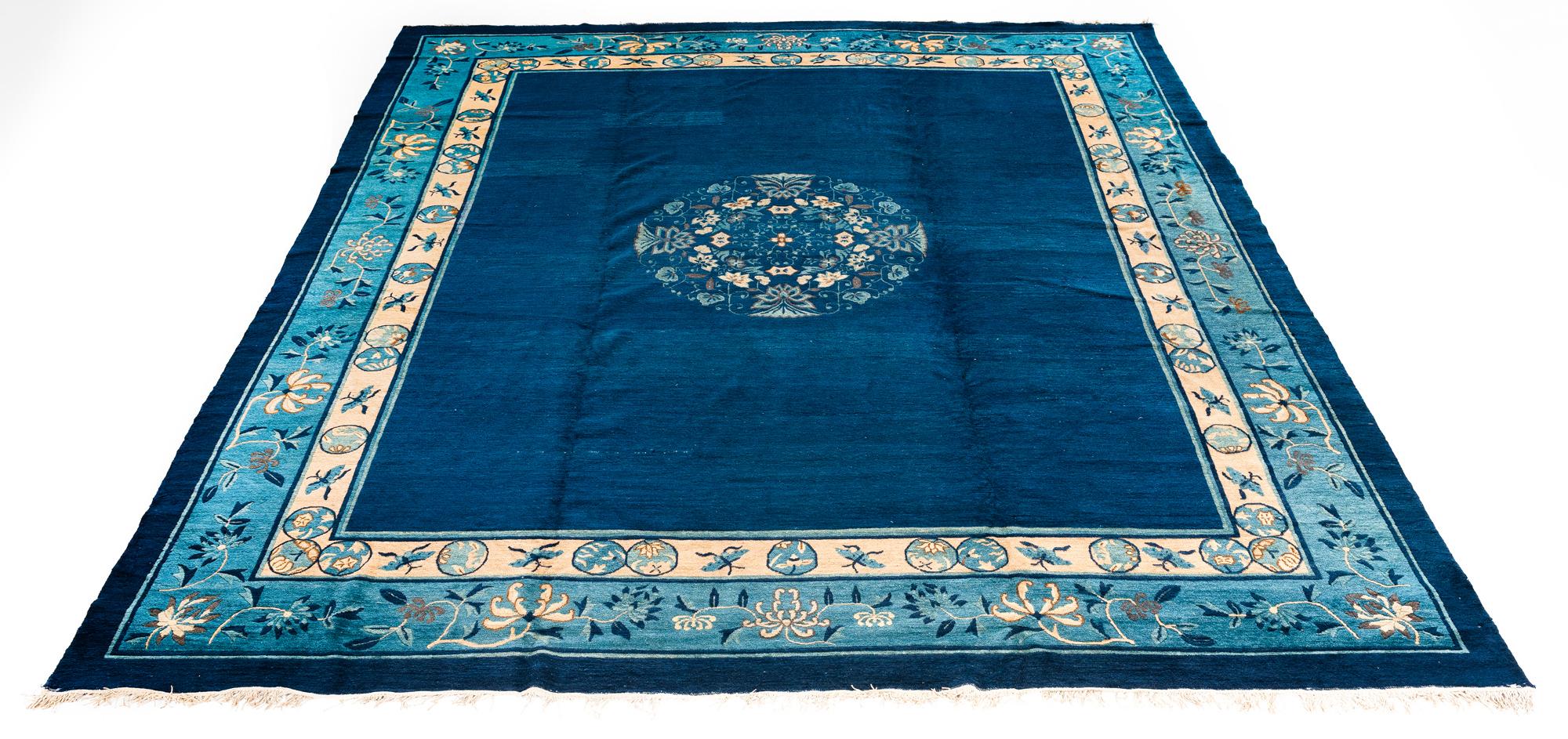 Chinese Export Antique Chinese Rug with Plain Blue Field with Patterned Borders and Butterflies For Sale