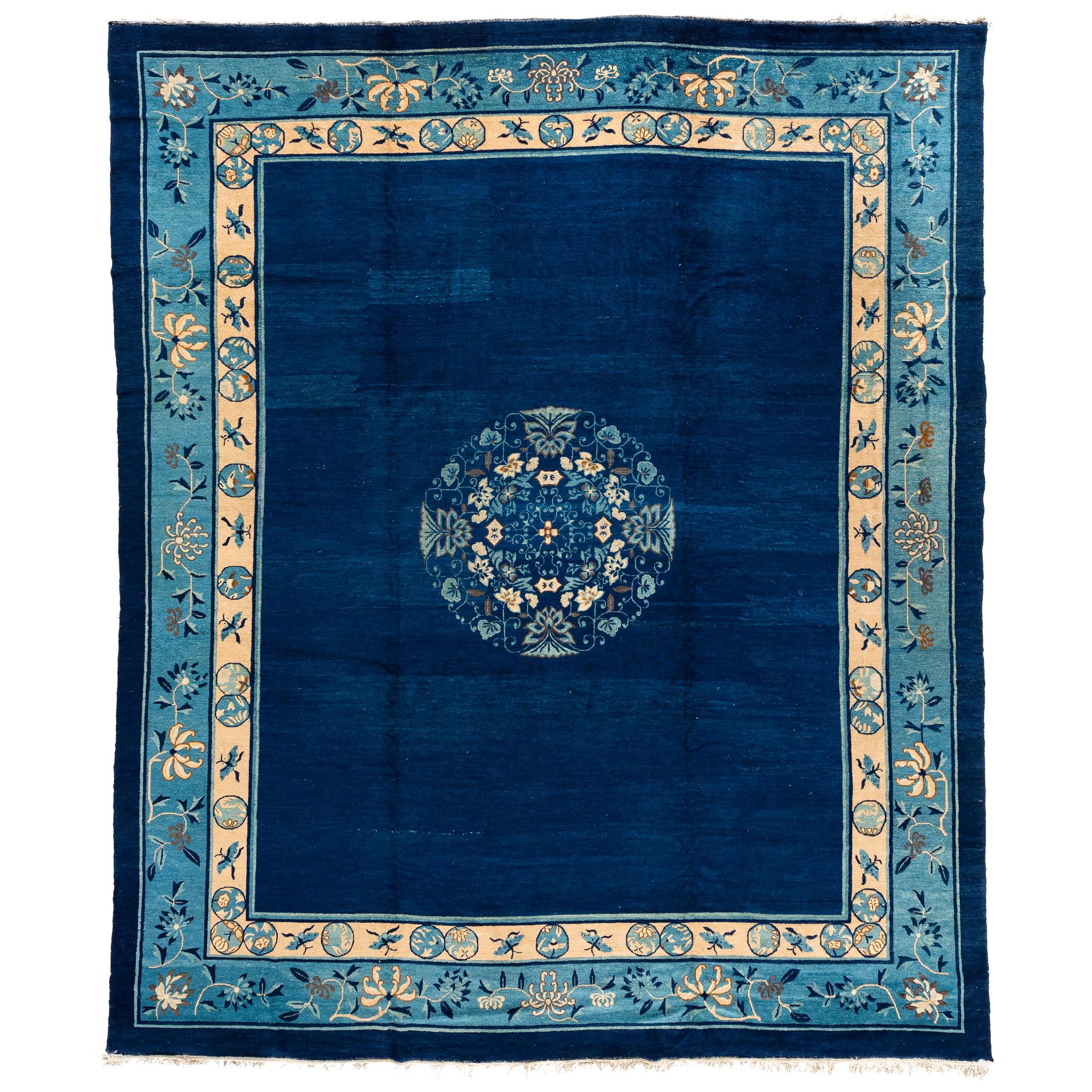 Antique Chinese Rug with Plain Blue Field with Patterned Borders and Butterflies For Sale