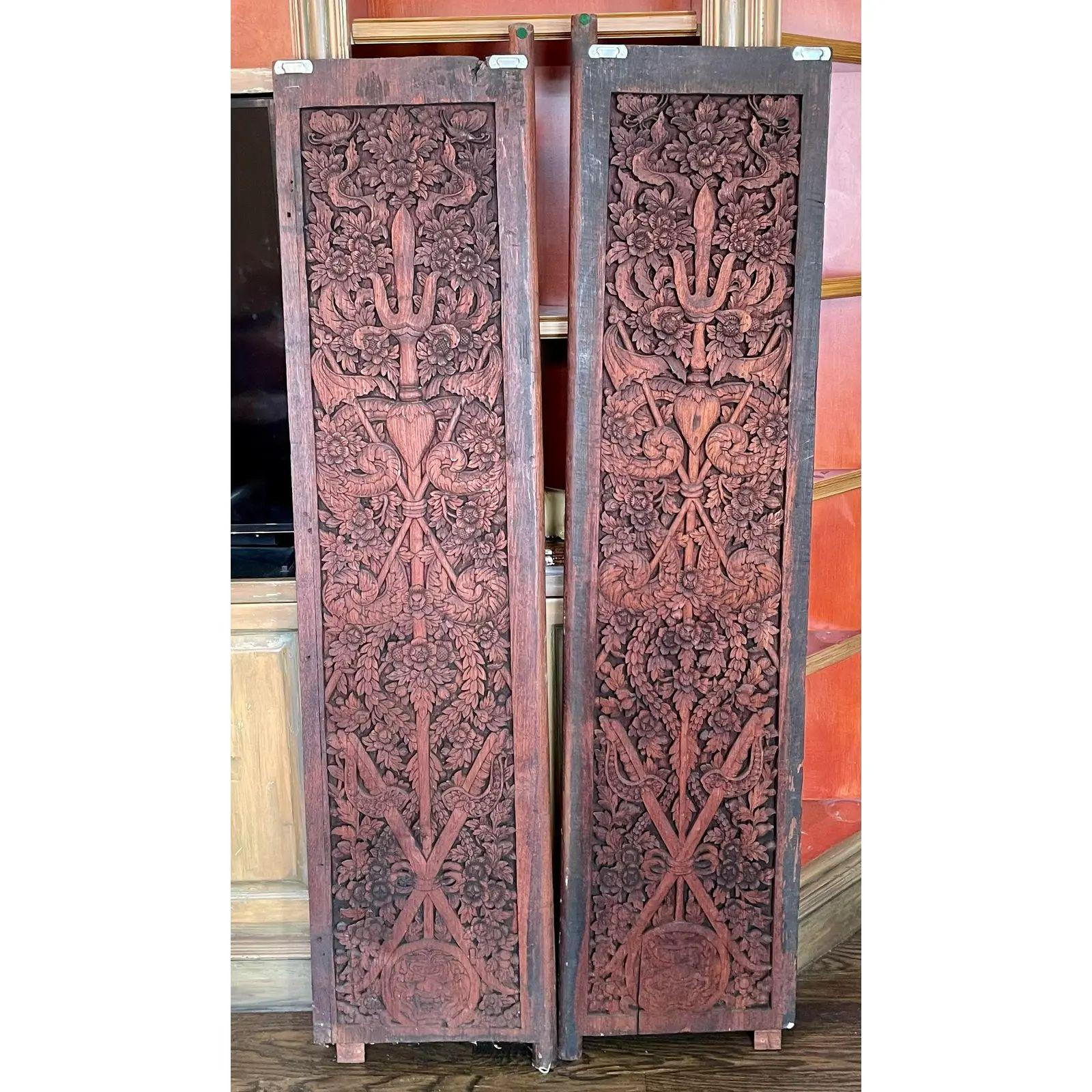 Antique Chinese scenic painted carved wood doors. Each door is beautifully carved on one side and candles painted on the other side with mang Ming style figures.

Additional information: 
Materials: paint, wood
Color: red
Period: 19th